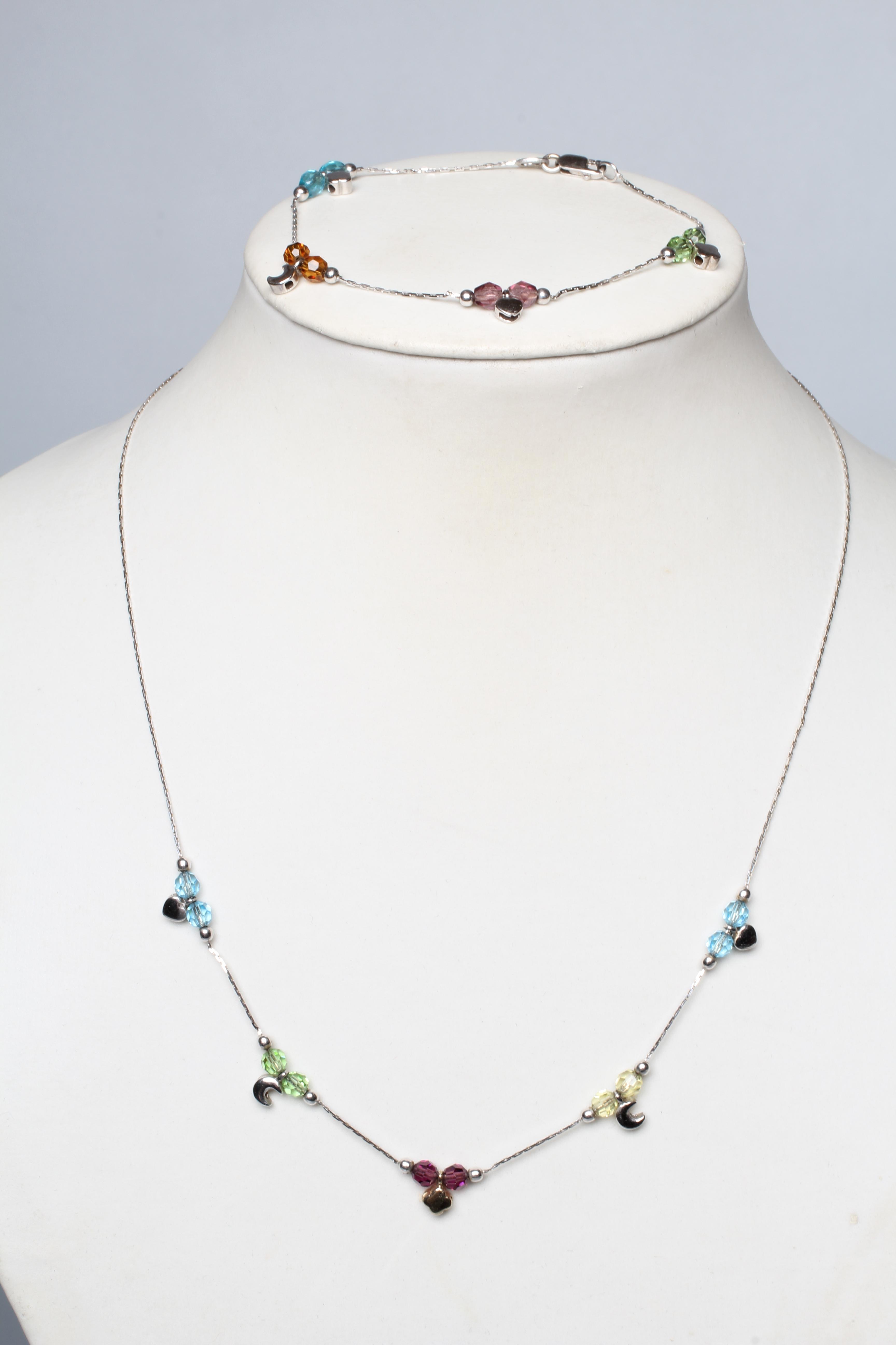 A MULTI-GEM SET NECKLACE AND MATCHING BRACELET, each set with pairs of facet cut beads including Image