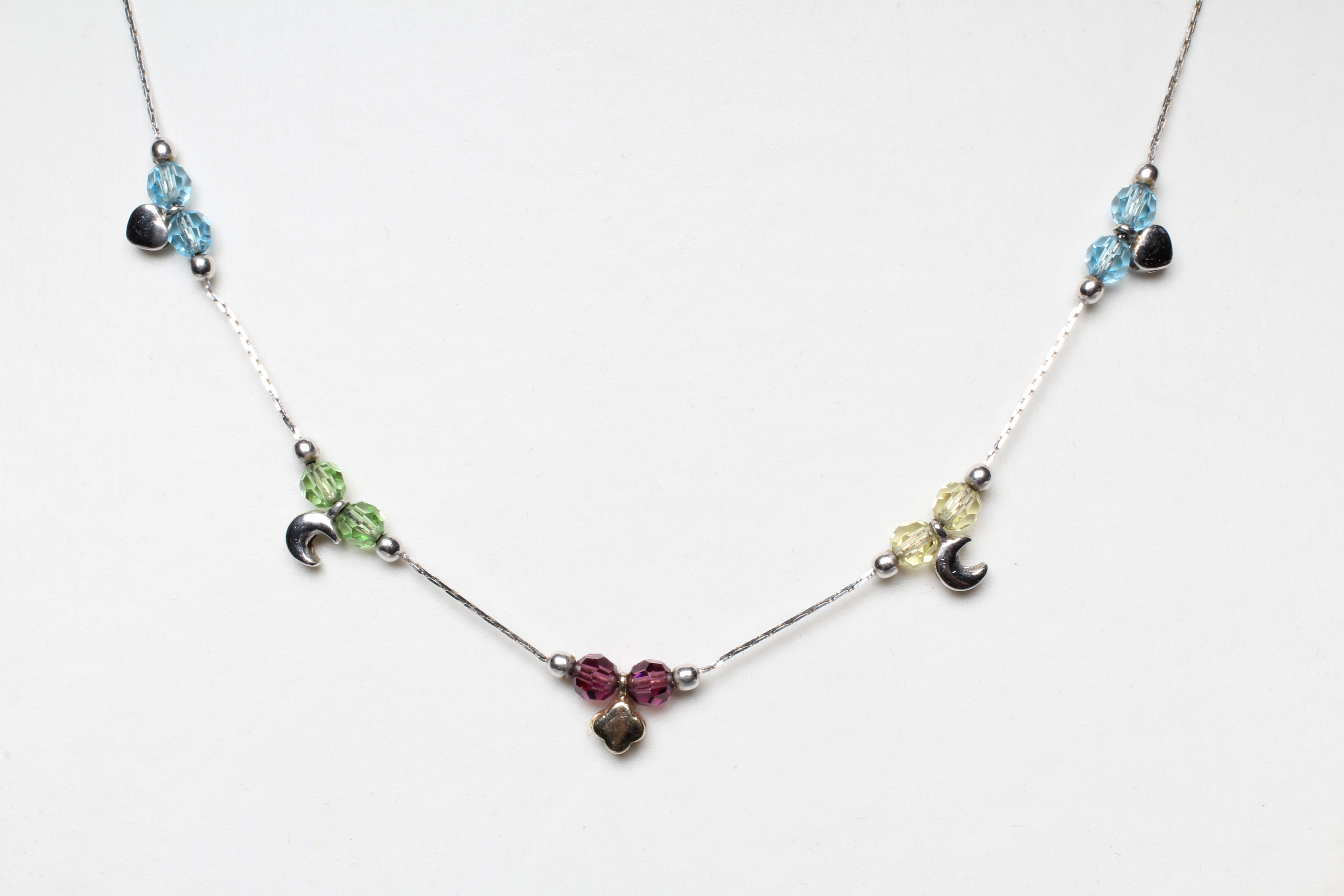 A MULTI-GEM SET NECKLACE AND MATCHING BRACELET, each set with pairs of facet cut beads including Image