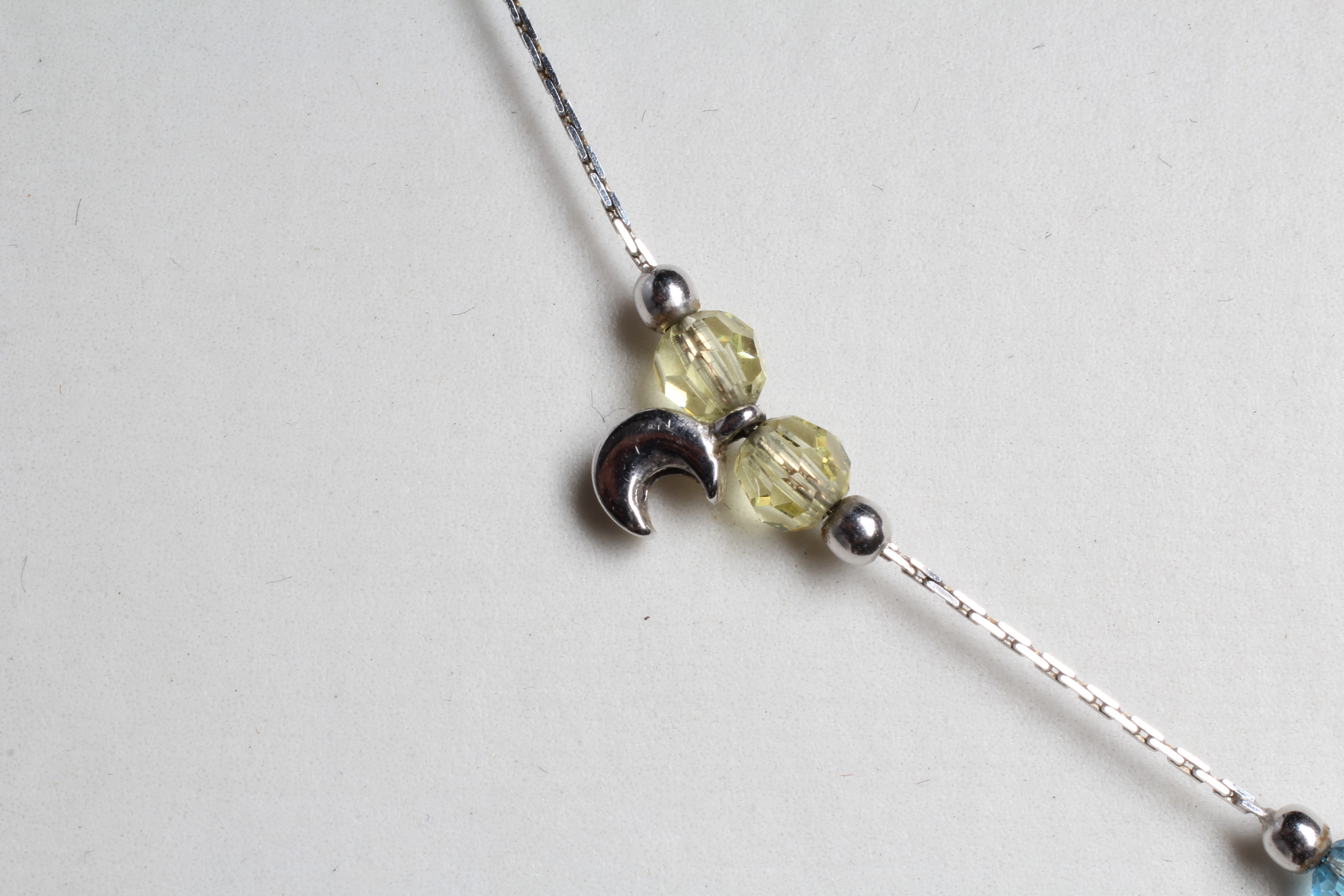 A MULTI-GEM SET NECKLACE AND MATCHING BRACELET, each set with pairs of facet cut beads including Image