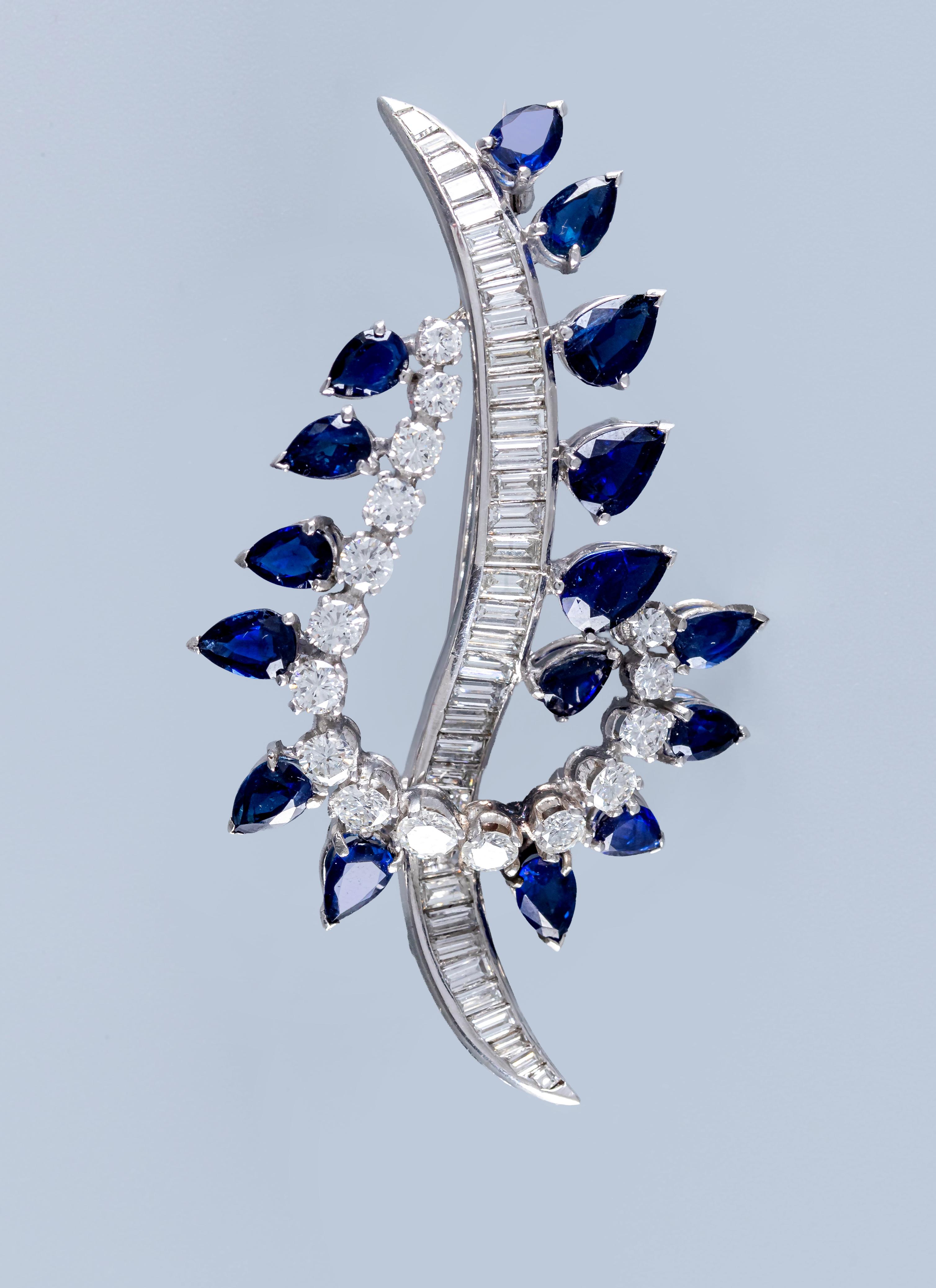 A SAPPHIRE AND DIAMOND COCKTAIL BROOCH of abstract leaf design Image