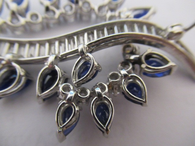 A SAPPHIRE AND DIAMOND COCKTAIL BROOCH of abstract leaf design Image