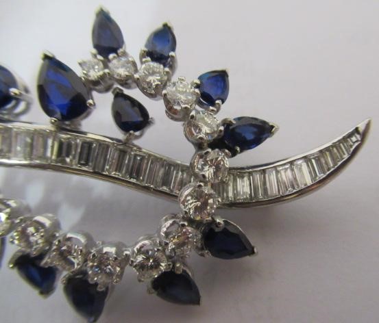 A SAPPHIRE AND DIAMOND COCKTAIL BROOCH of abstract leaf design Image