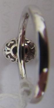 A PINK SAPPHIRE AND DIAMOND CLUSTER RING, the oval facet cut sapphire claw set to a border of small Image