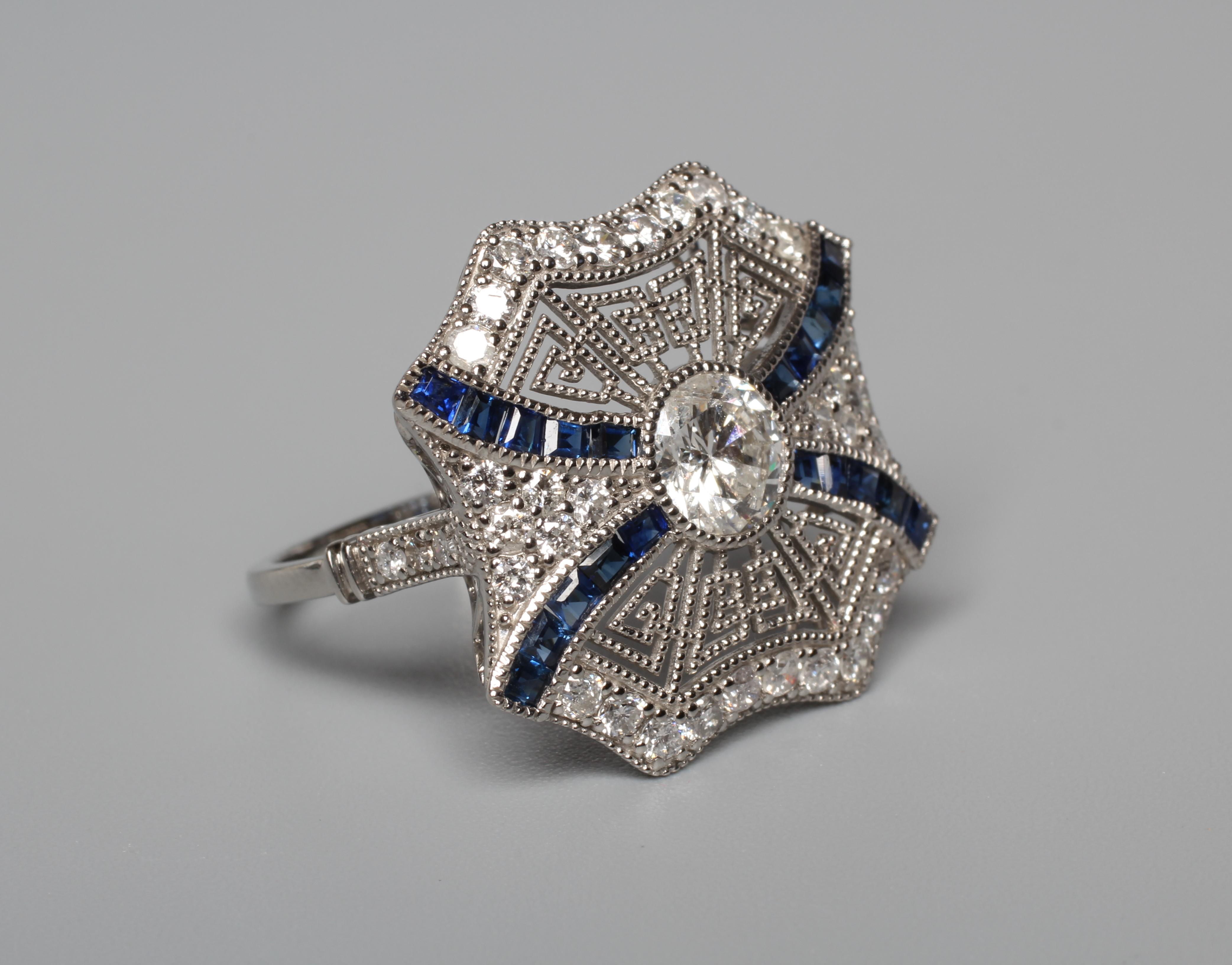 AN ART DECO STYLE DIAMOND AND SAPPHIRE SPIDER'S WEB RING Image