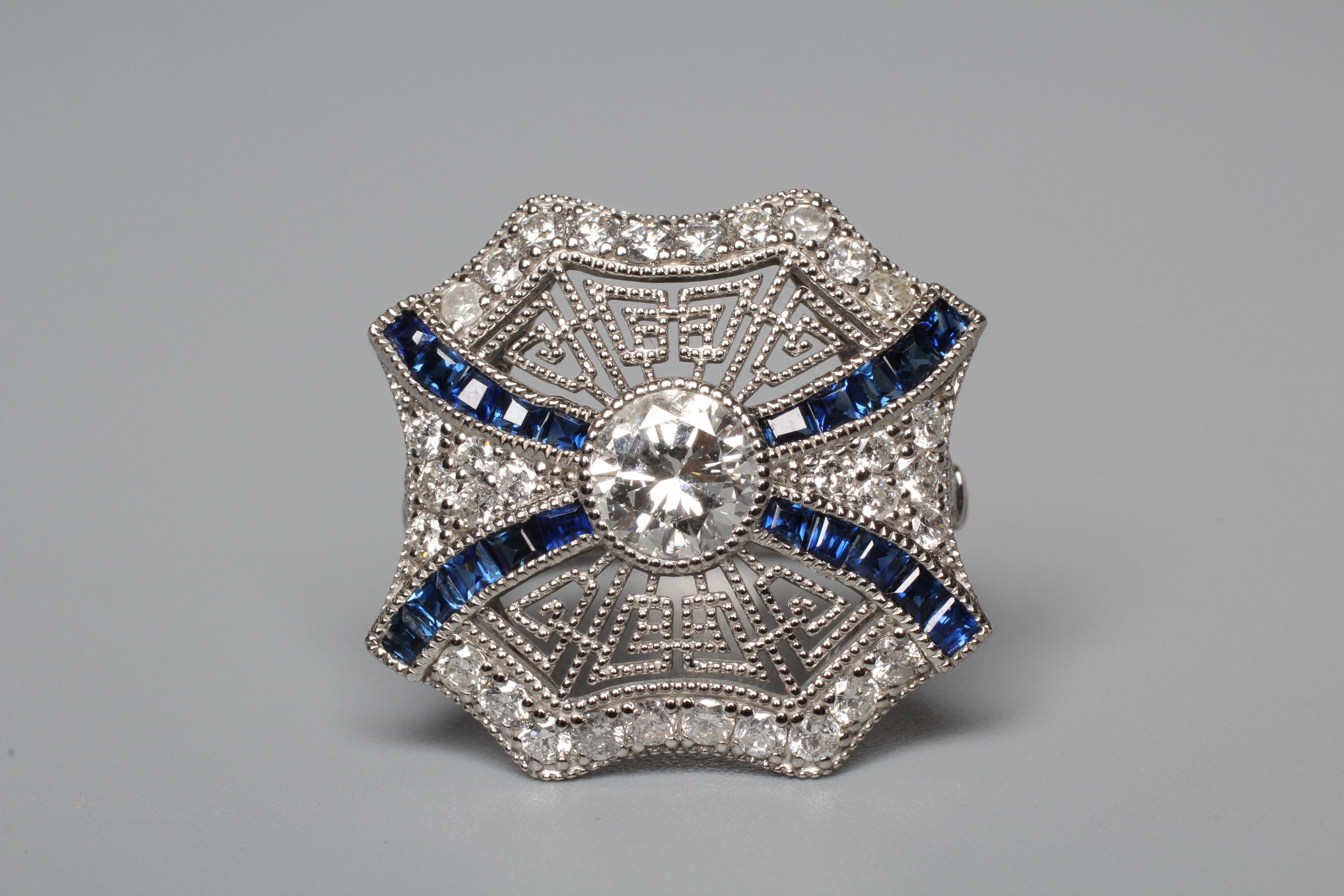AN ART DECO STYLE DIAMOND AND SAPPHIRE SPIDER'S WEB RING Image