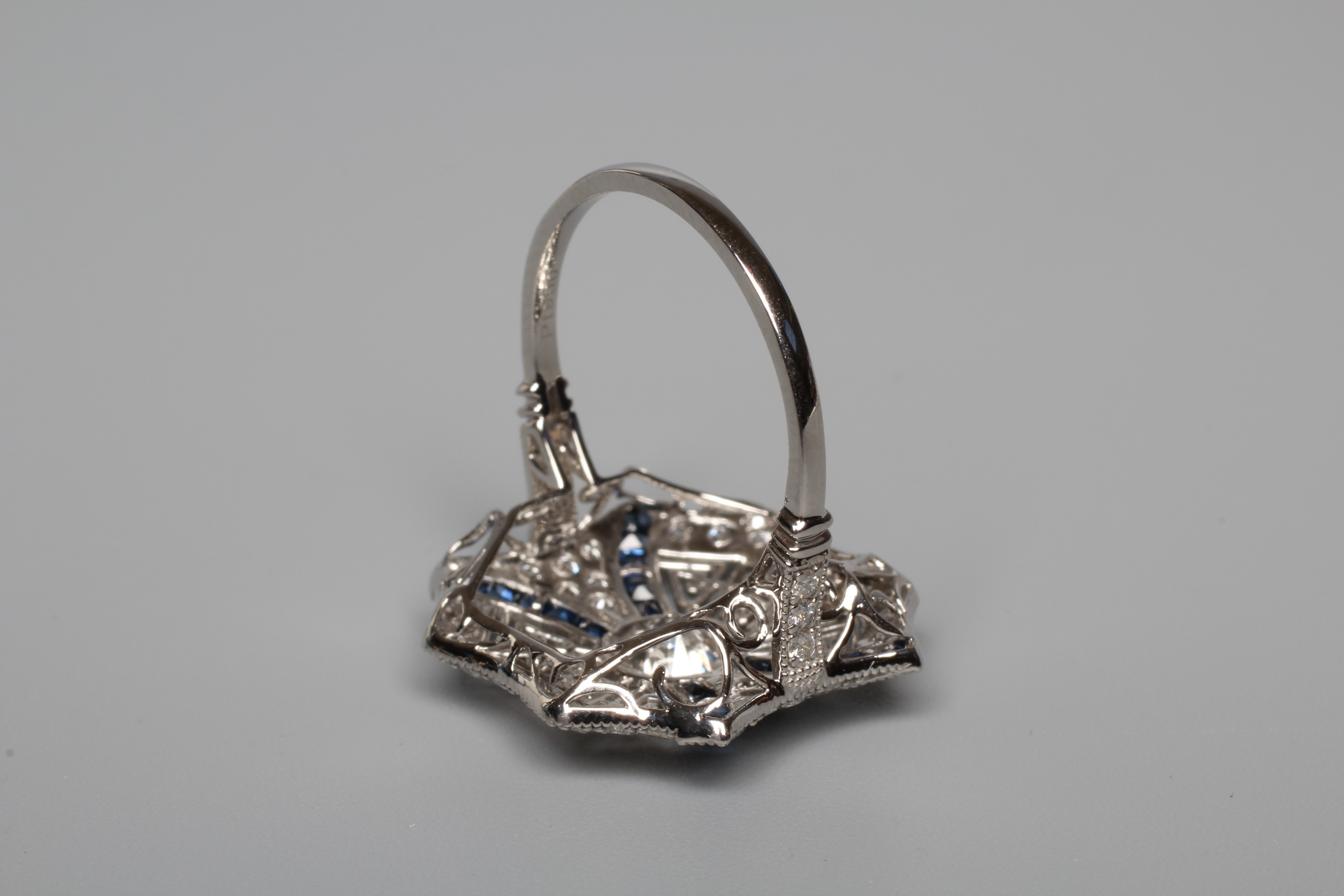 AN ART DECO STYLE DIAMOND AND SAPPHIRE SPIDER'S WEB RING Image