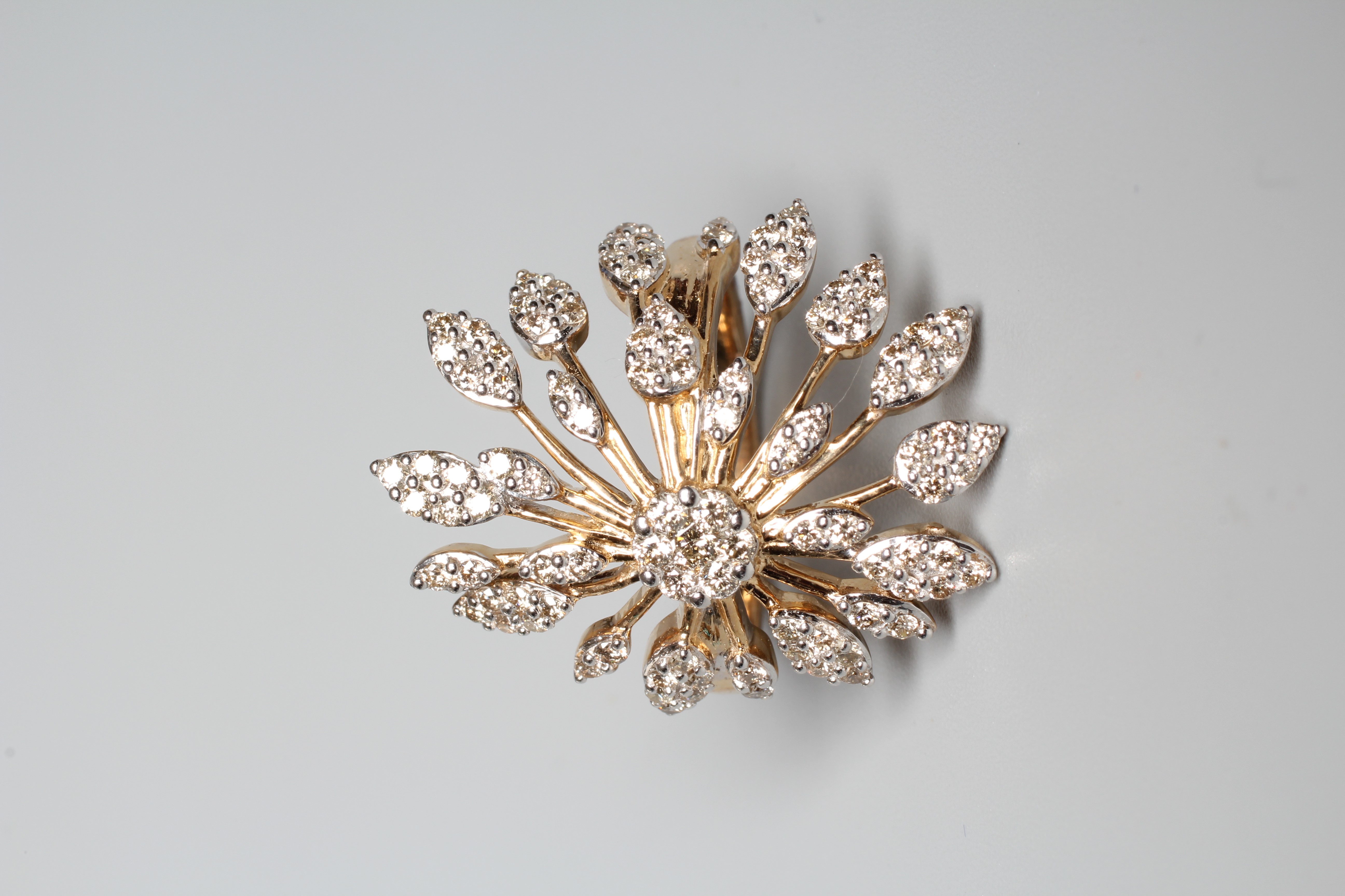 A DIAMOND STAR BURST RING, the round brilliants point set to a rose gold frame and plain shank, size Image