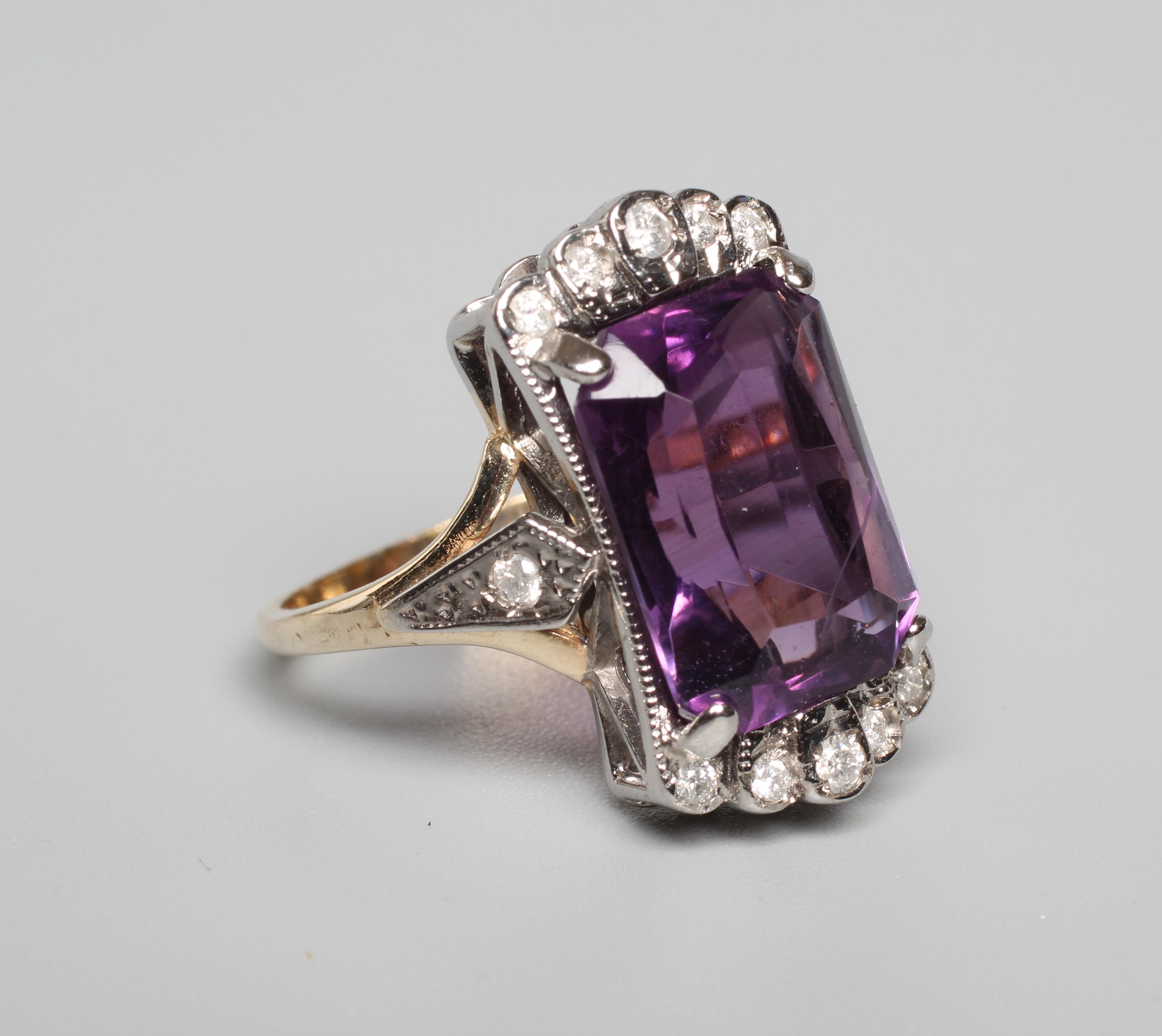 AN AMETHYST AND DIAMOND COCKTAIL RING, the emerald cut amethyst claw set to diamond angles and Image