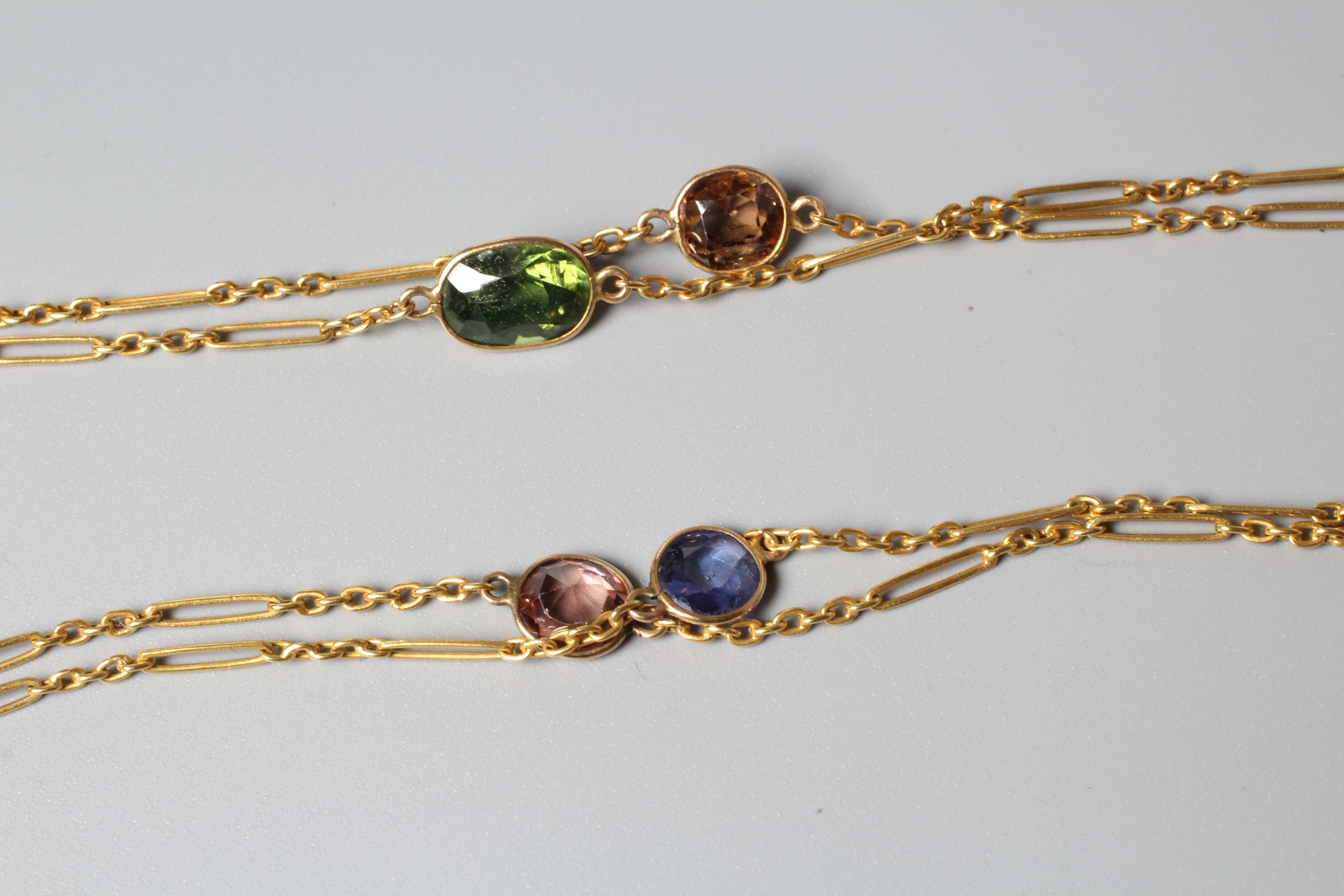 AN EDWARDIAN FETTER LINK GUARD CHAIN, unmarked with dog clip fastener, collet set with numerous Image