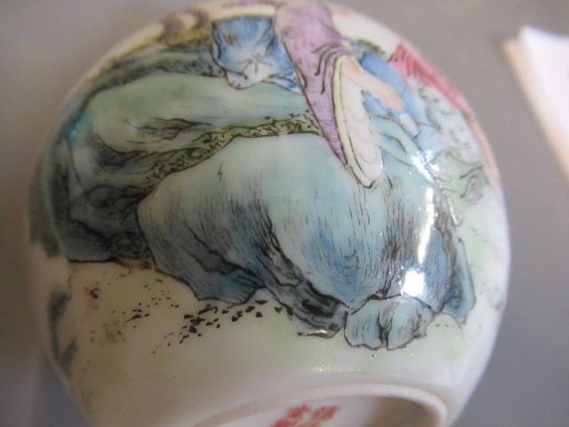 A CHINESE PORCELAIN SMALL BOTTLE VASE painted in coloured enamels with two figures seated beneath Image