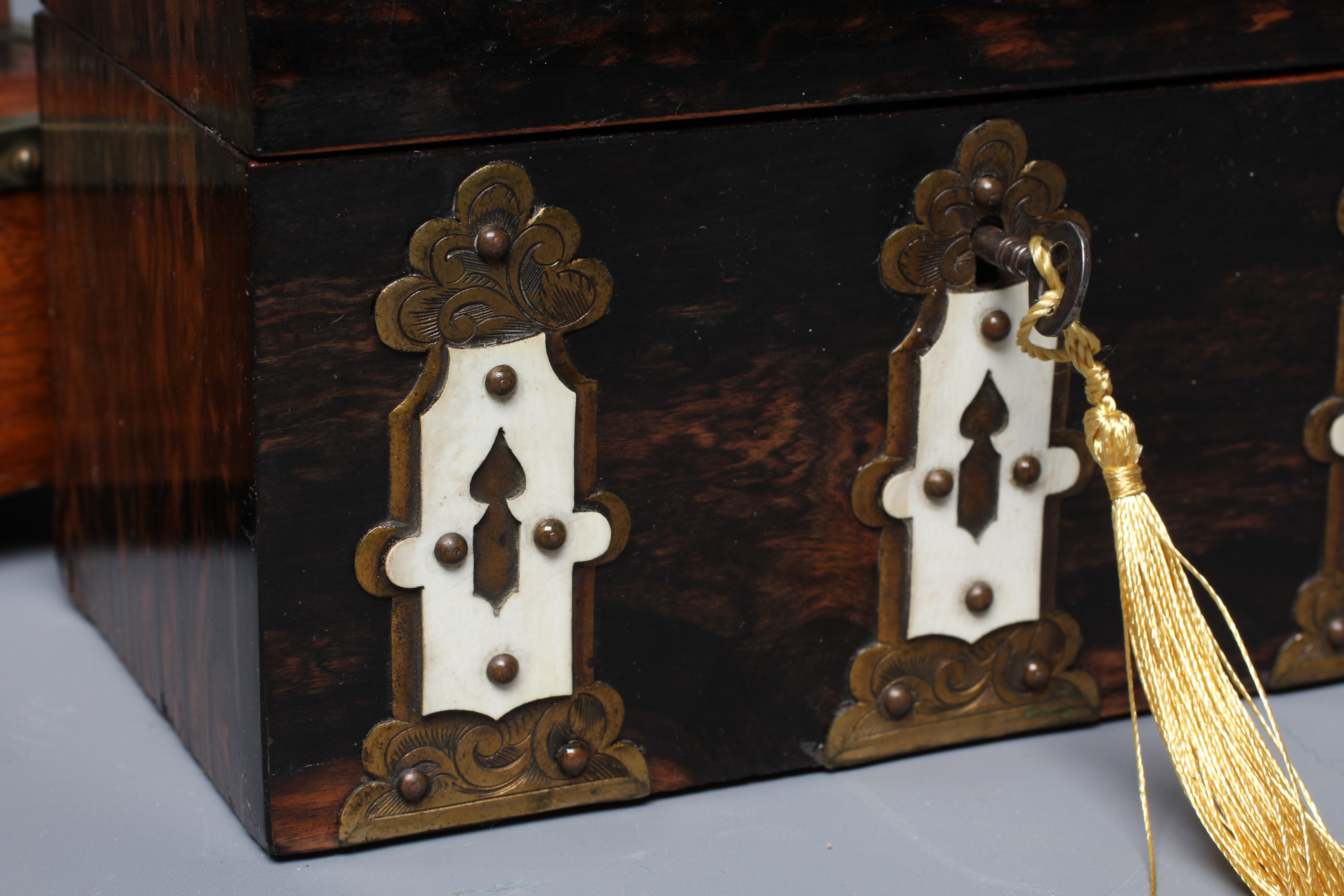 A VICTORIAN COROMANDEL DOMED STATIONERY CASKET with ornate brass and ivory Gothic revival mounts and Image