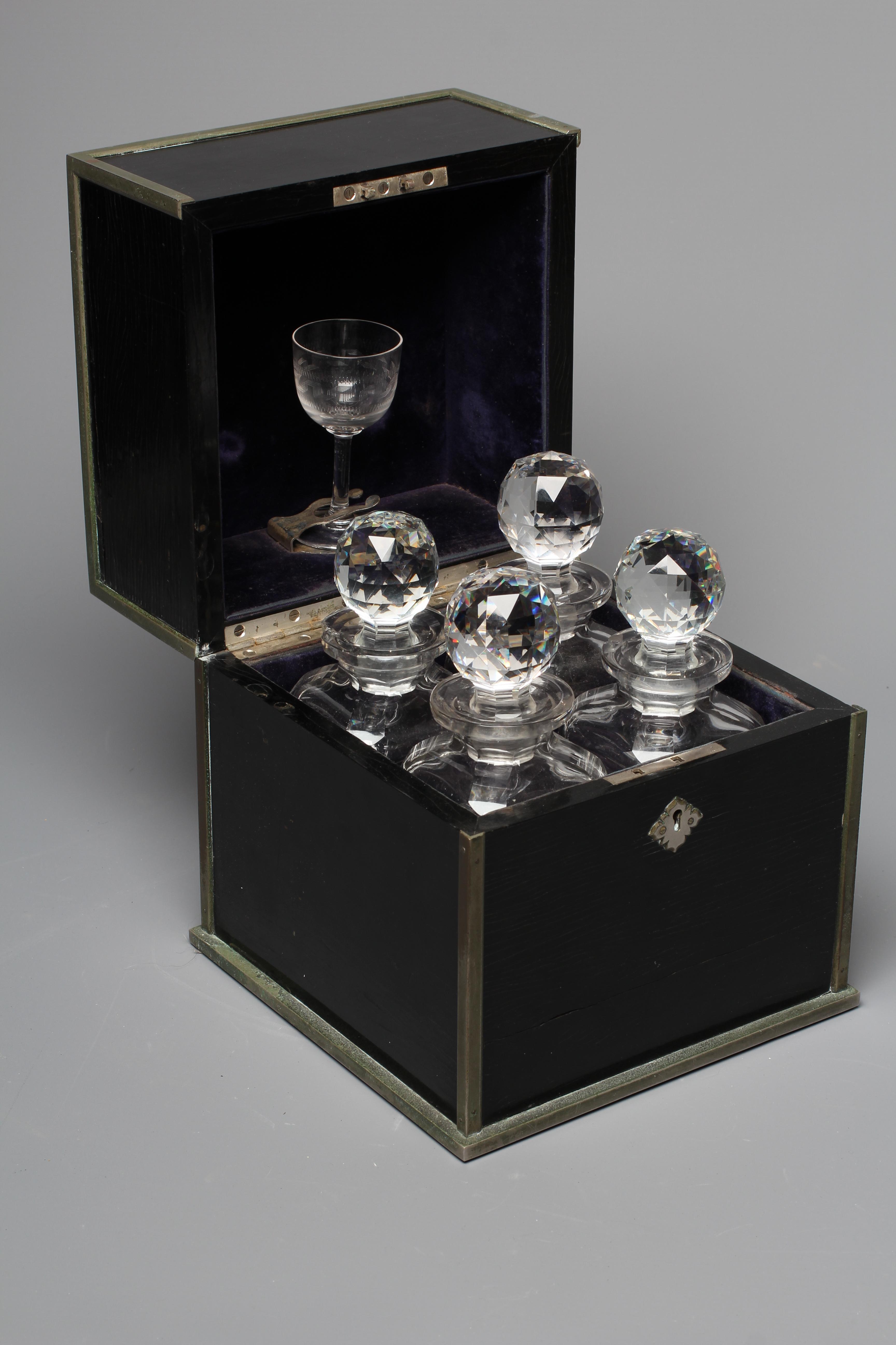 A 19TH CENTURY BRASS BOUND BLACK LACQUER SQUARE DECANTER BOX Image