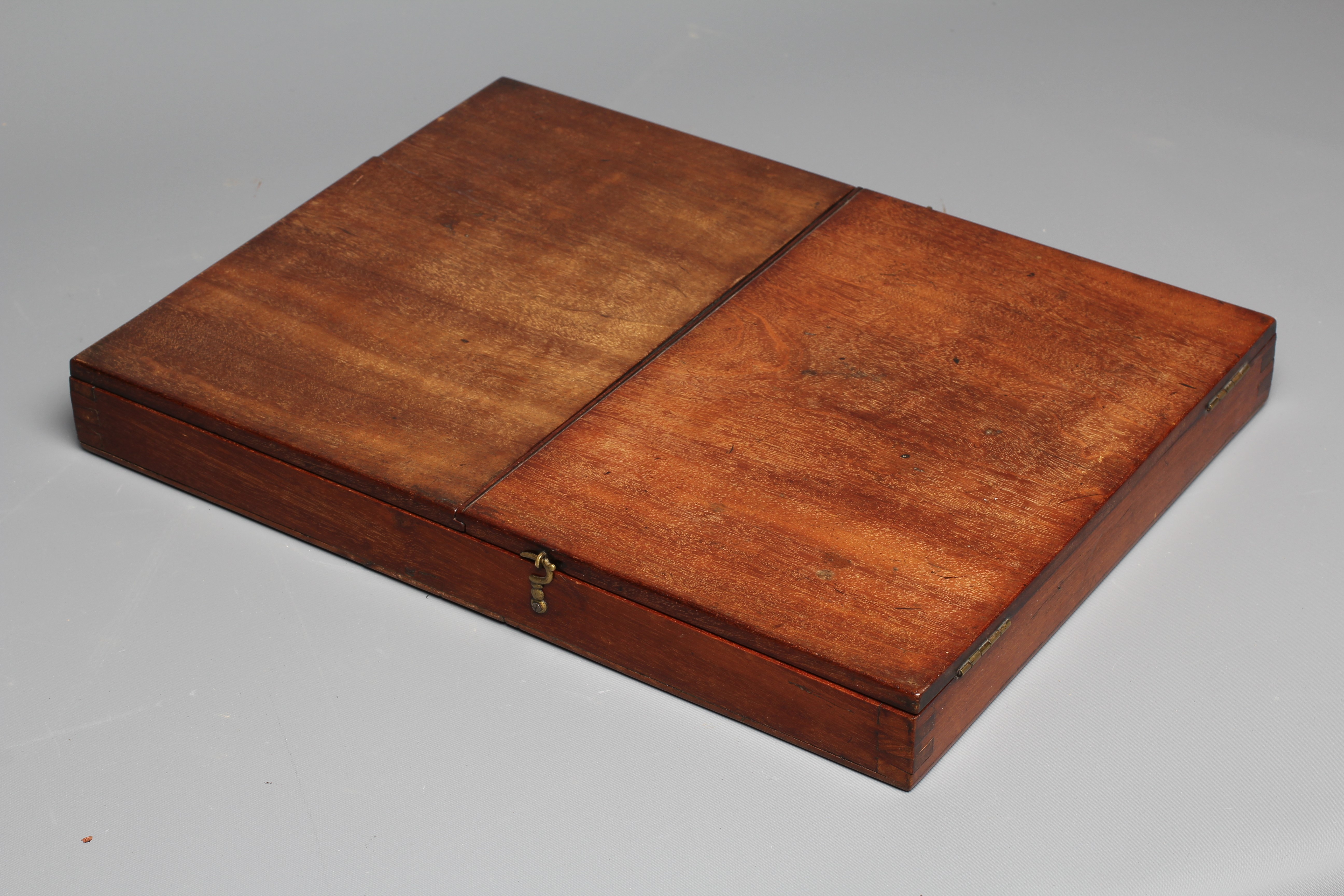 A 19TH CENTURY FOLDING CAMPAIGN MIRROR, the oblong plate in a moulded frame folding into a Image