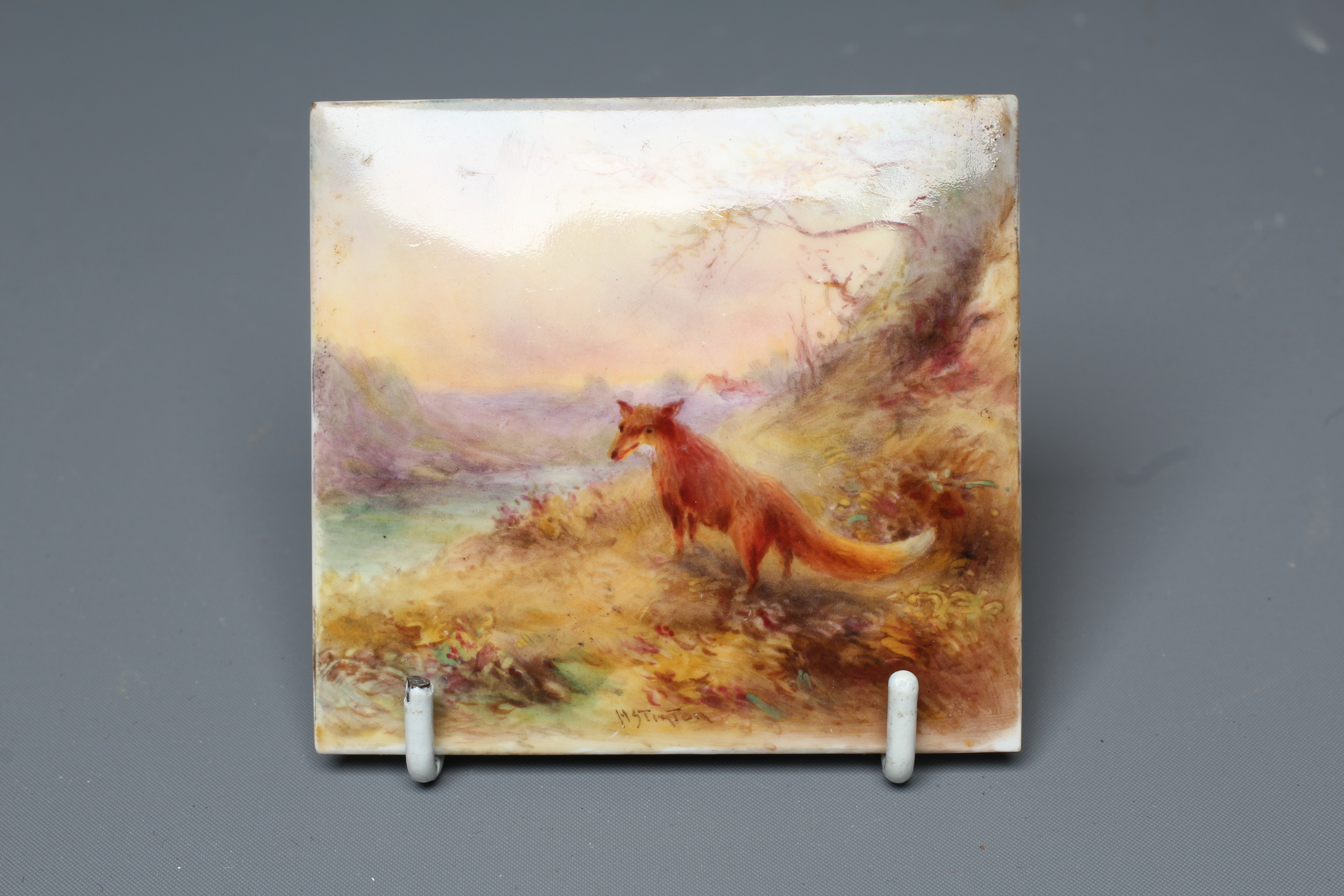 A ROYAL WORCESTER SMALL SQUARE PLAQUE, 1928, painted by Harry Stinton with a fox beside a tree Image
