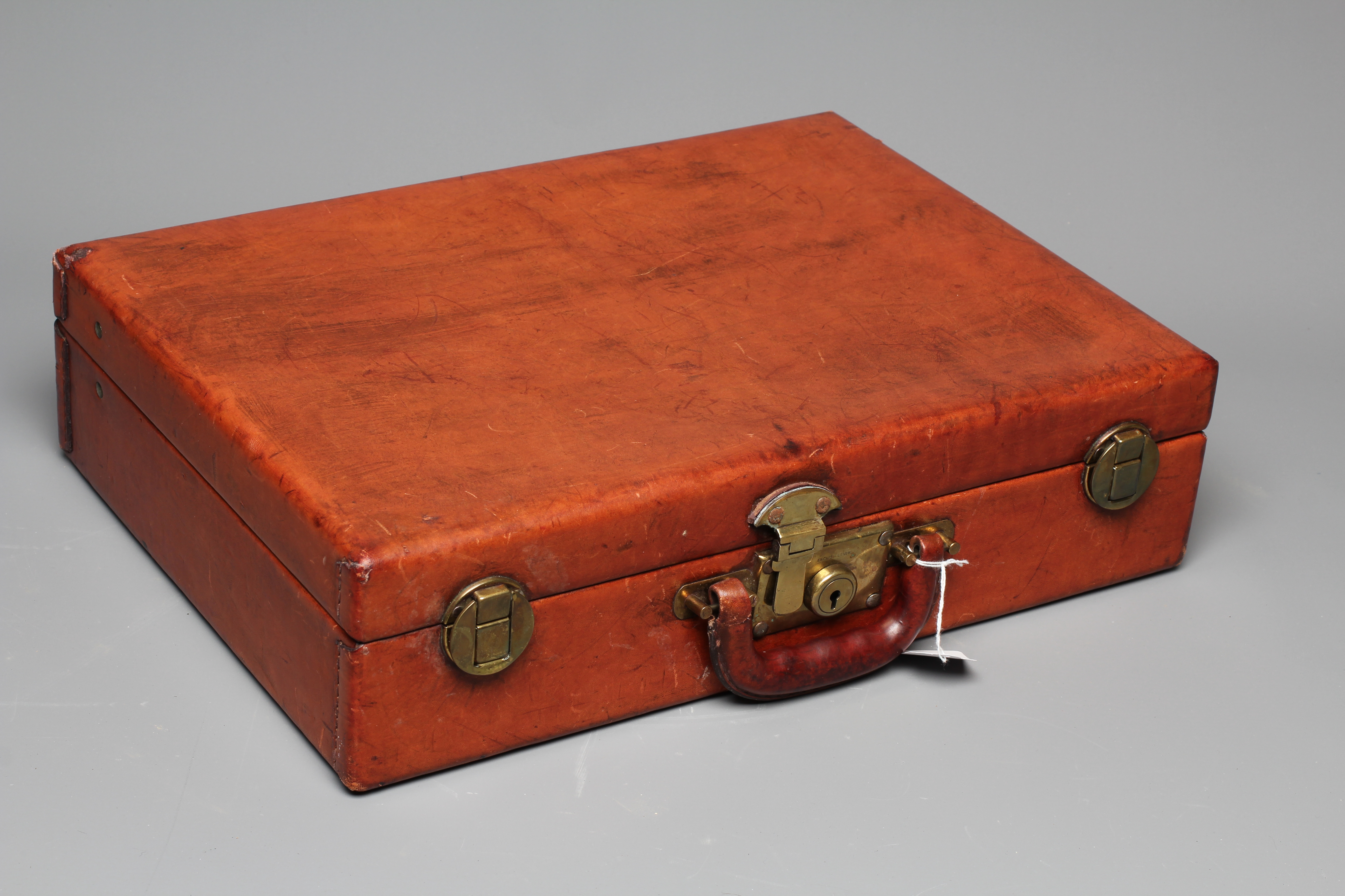 A PEDRO'S LUGGAGE TAN LEATHER BRIEFCASE with gold tone hardware and a leather handle, the interior Image