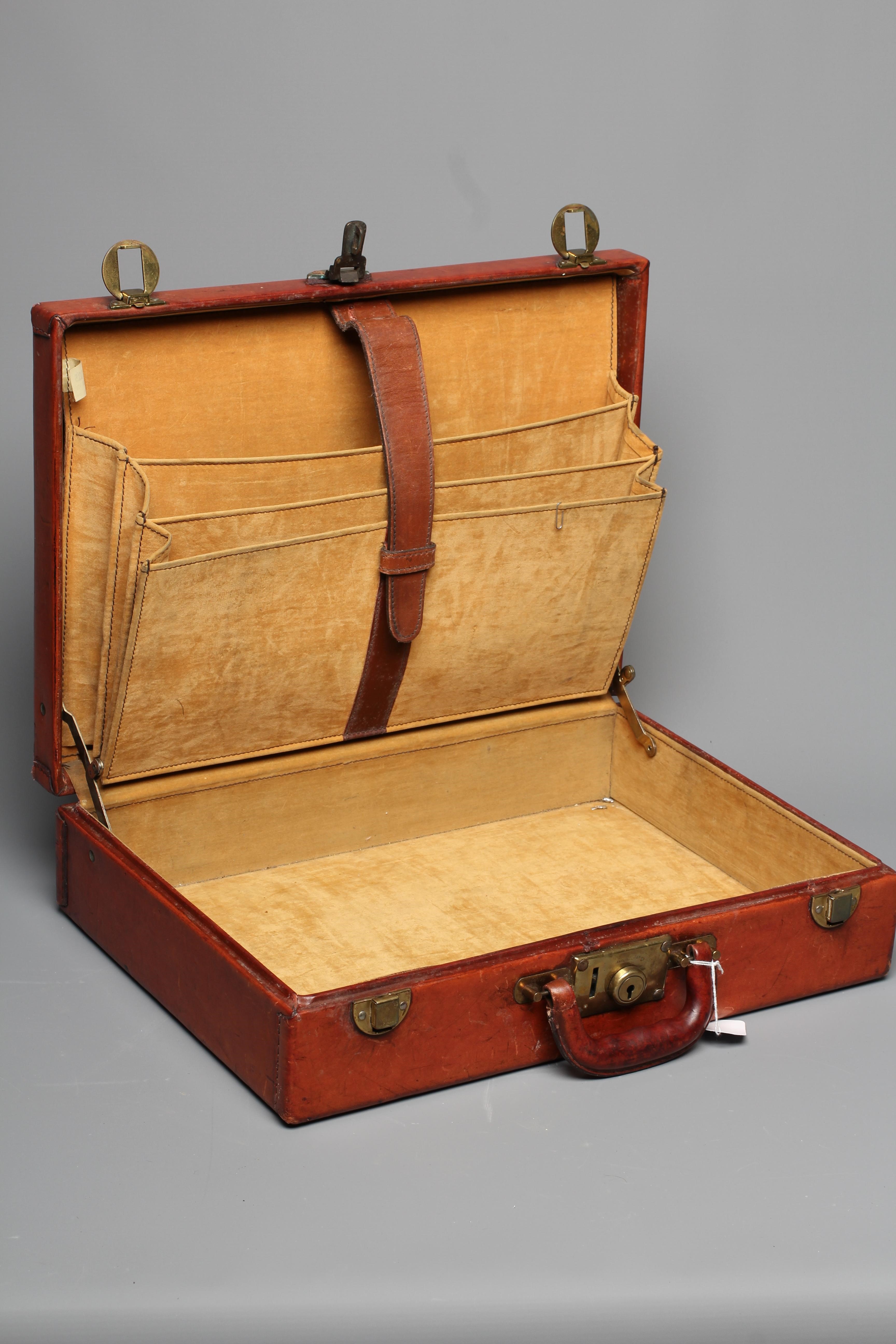 A PEDRO'S LUGGAGE TAN LEATHER BRIEFCASE with gold tone hardware and a leather handle, the interior Image