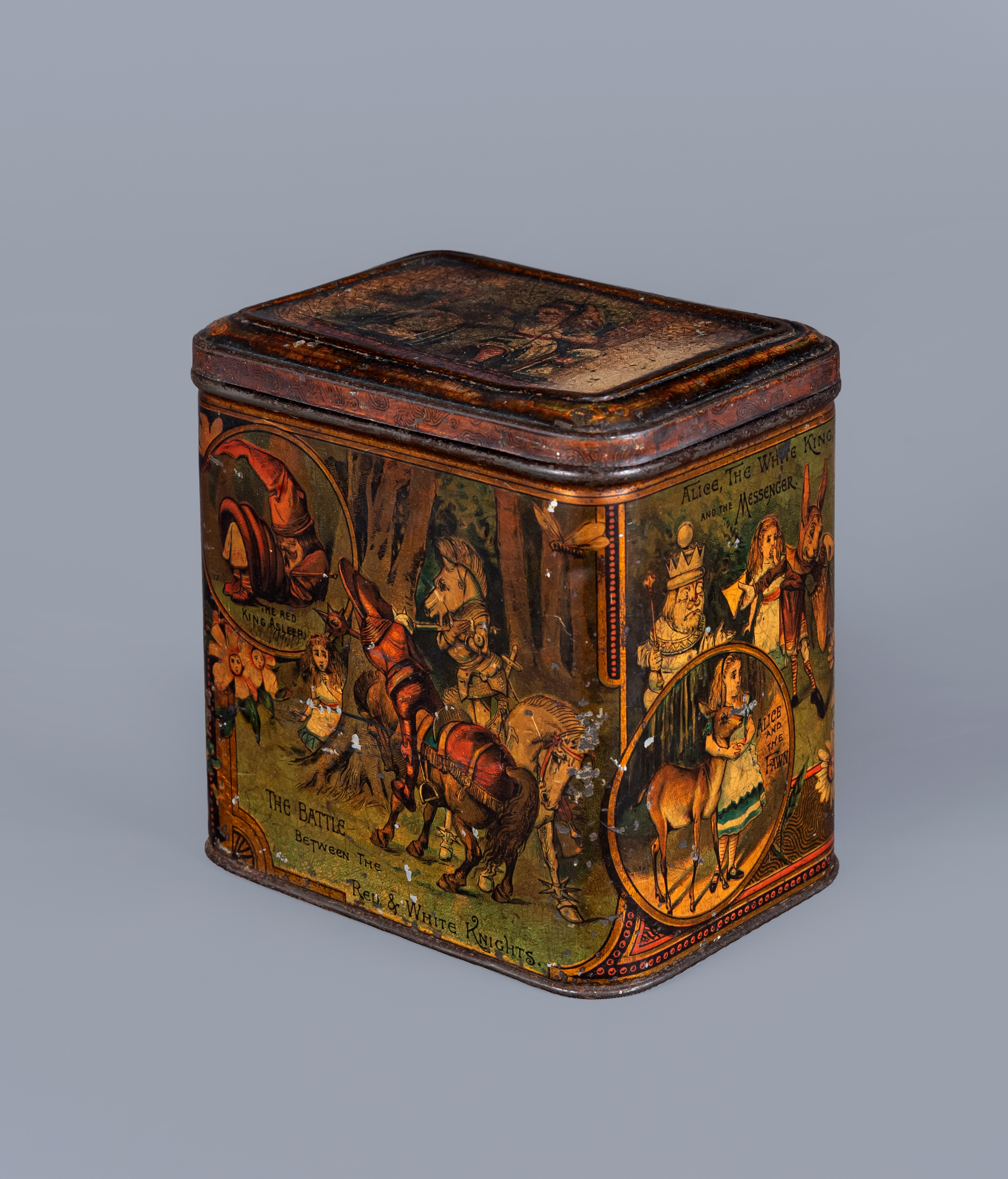A VICTORIAN 'ALICE IN WONDERLAND' BISCUIT TIN BY W & R JACOBS LTD. of rounded oblong form Image