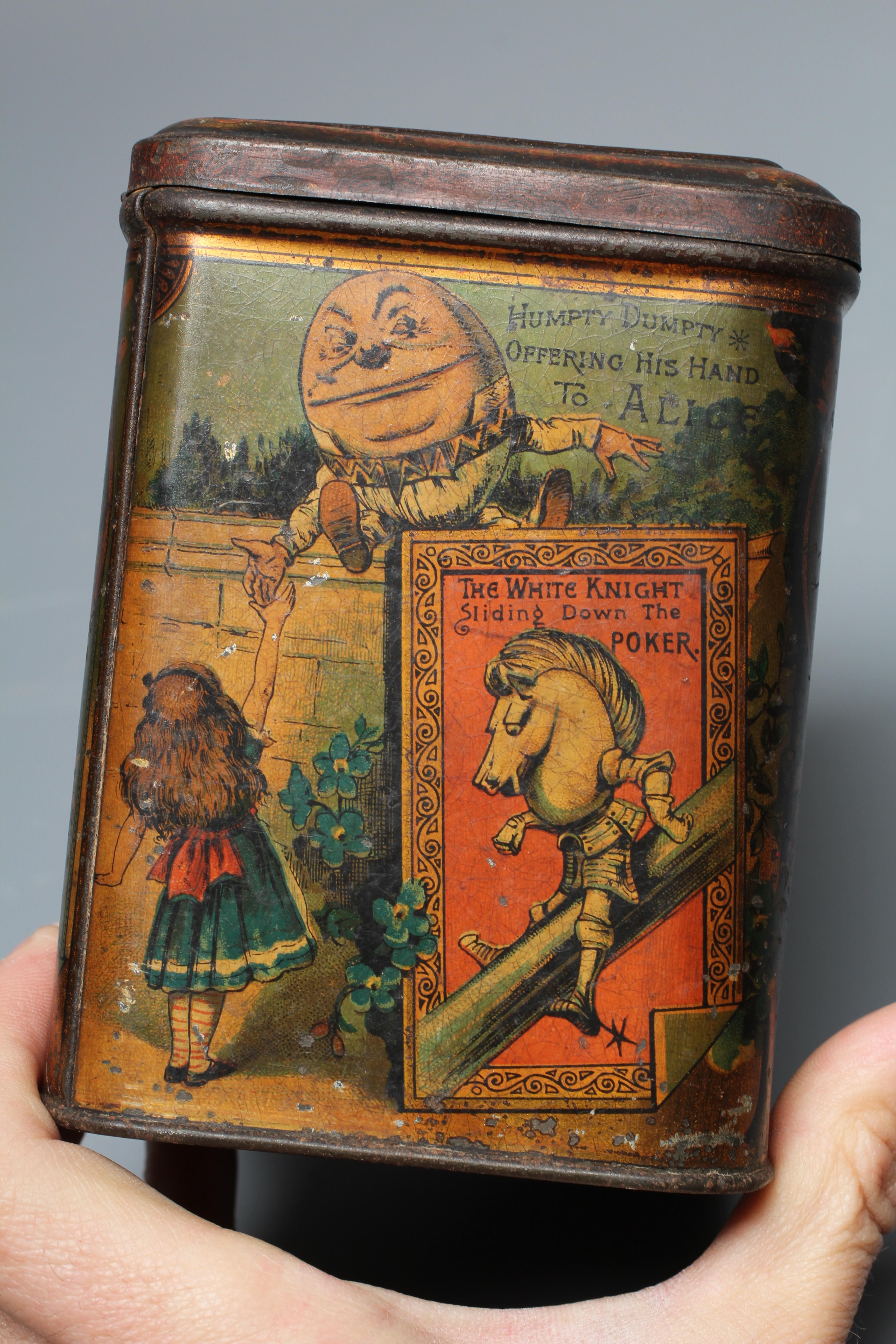 A VICTORIAN 'ALICE IN WONDERLAND' BISCUIT TIN BY W & R JACOBS LTD. of rounded oblong form Image