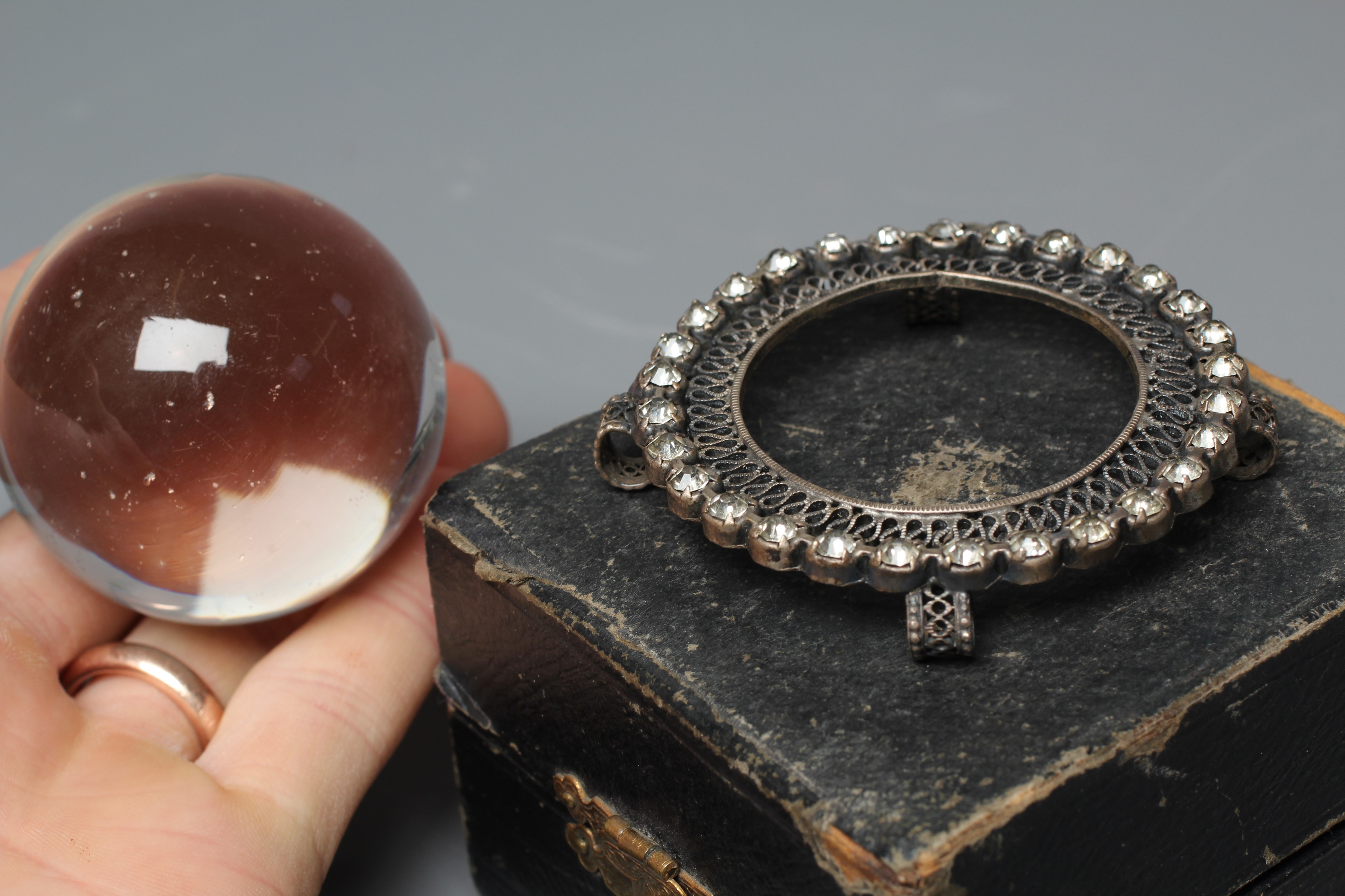 A CRYSTAL BALL, early 20th century, in original silk and velvet lined case, retailed by Two Worlds Image