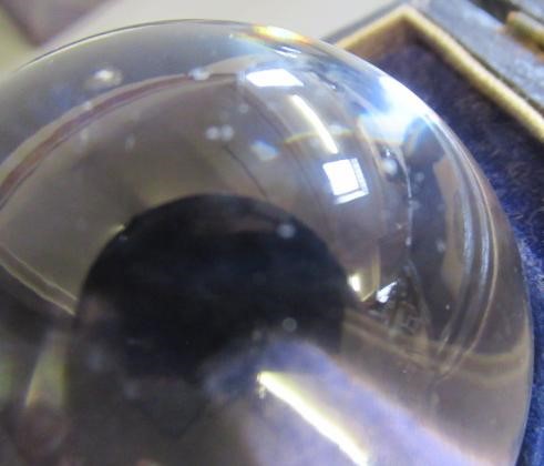 A CRYSTAL BALL, early 20th century, in original silk and velvet lined case, retailed by Two Worlds Image