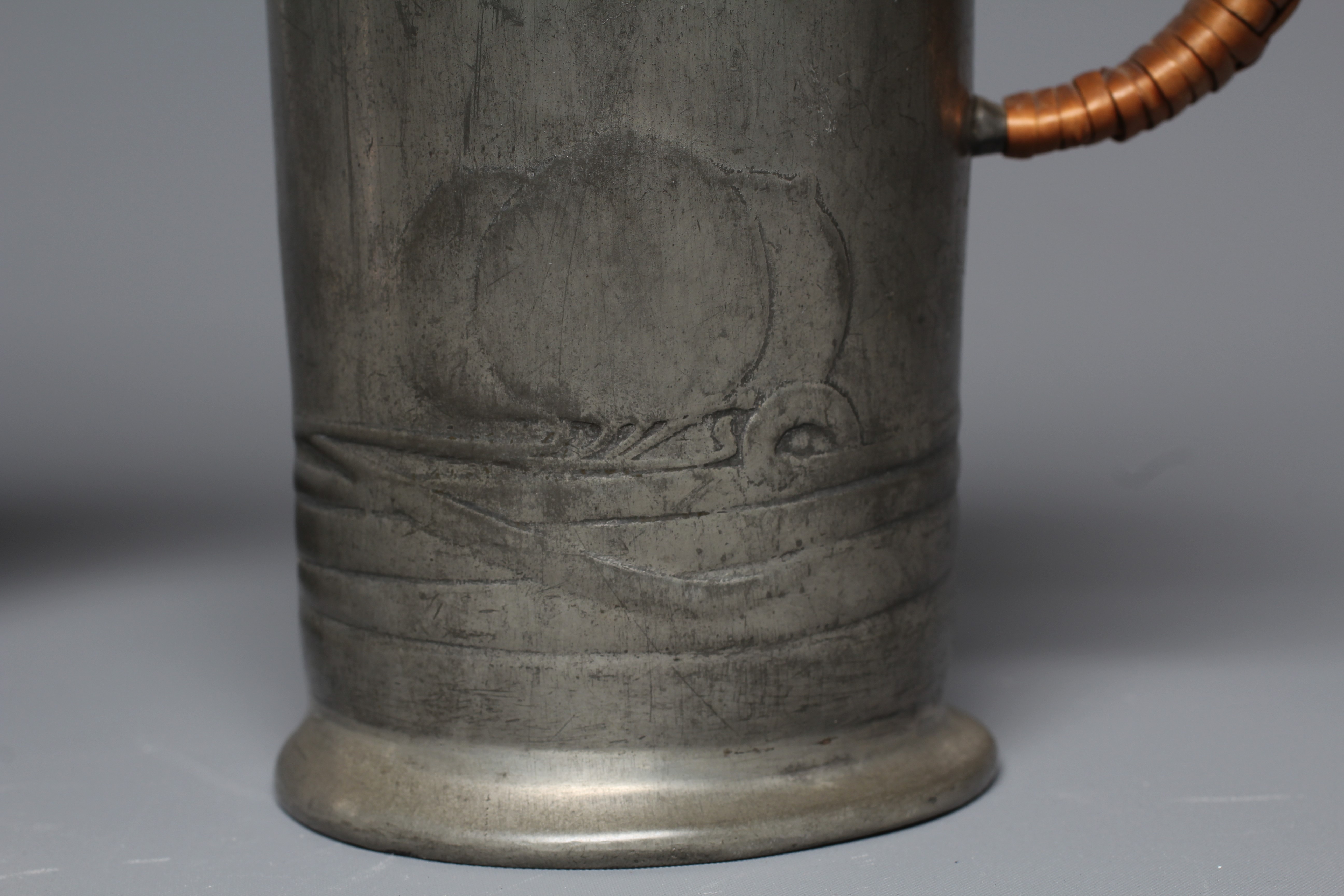 ARCHIBALD KNOX FOR LIBERTY & CO. - An English Pewter tankard of plain cylindrical form Image