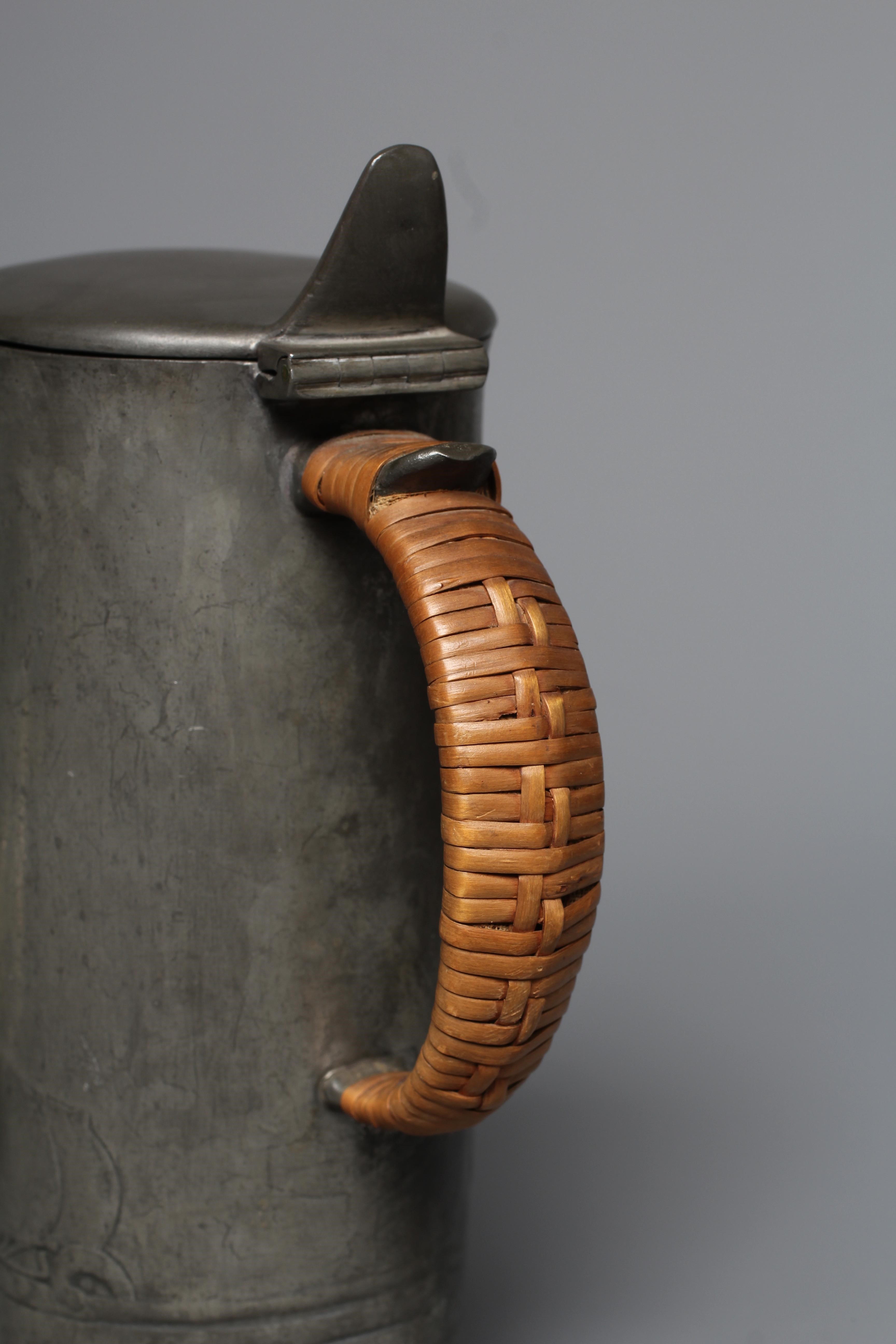 ARCHIBALD KNOX FOR LIBERTY & CO. - An English Pewter tankard of plain cylindrical form Image
