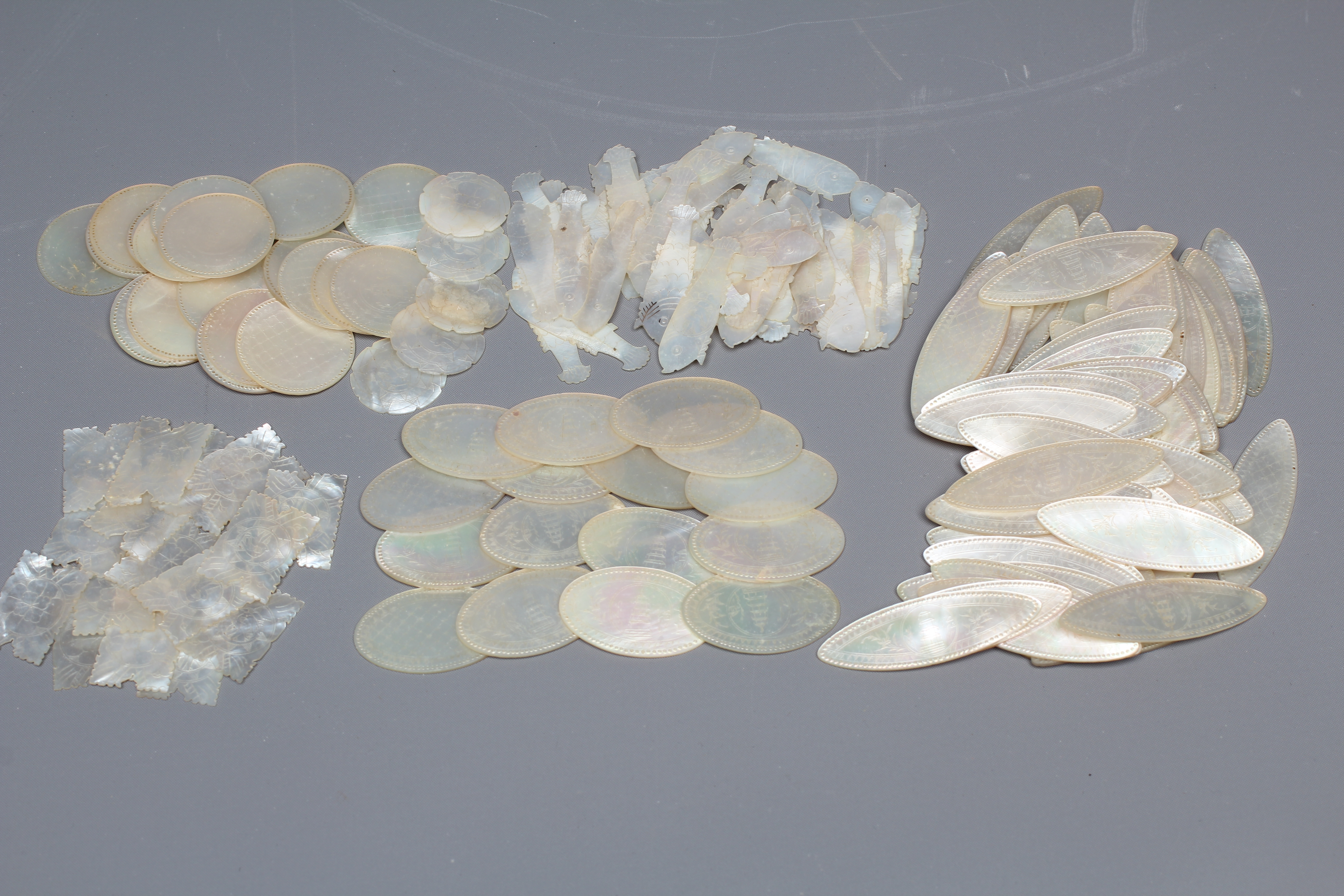 A COLLECTION OF CHINESE MOTHER-OF-PEARL GAMING COUNTERS Image