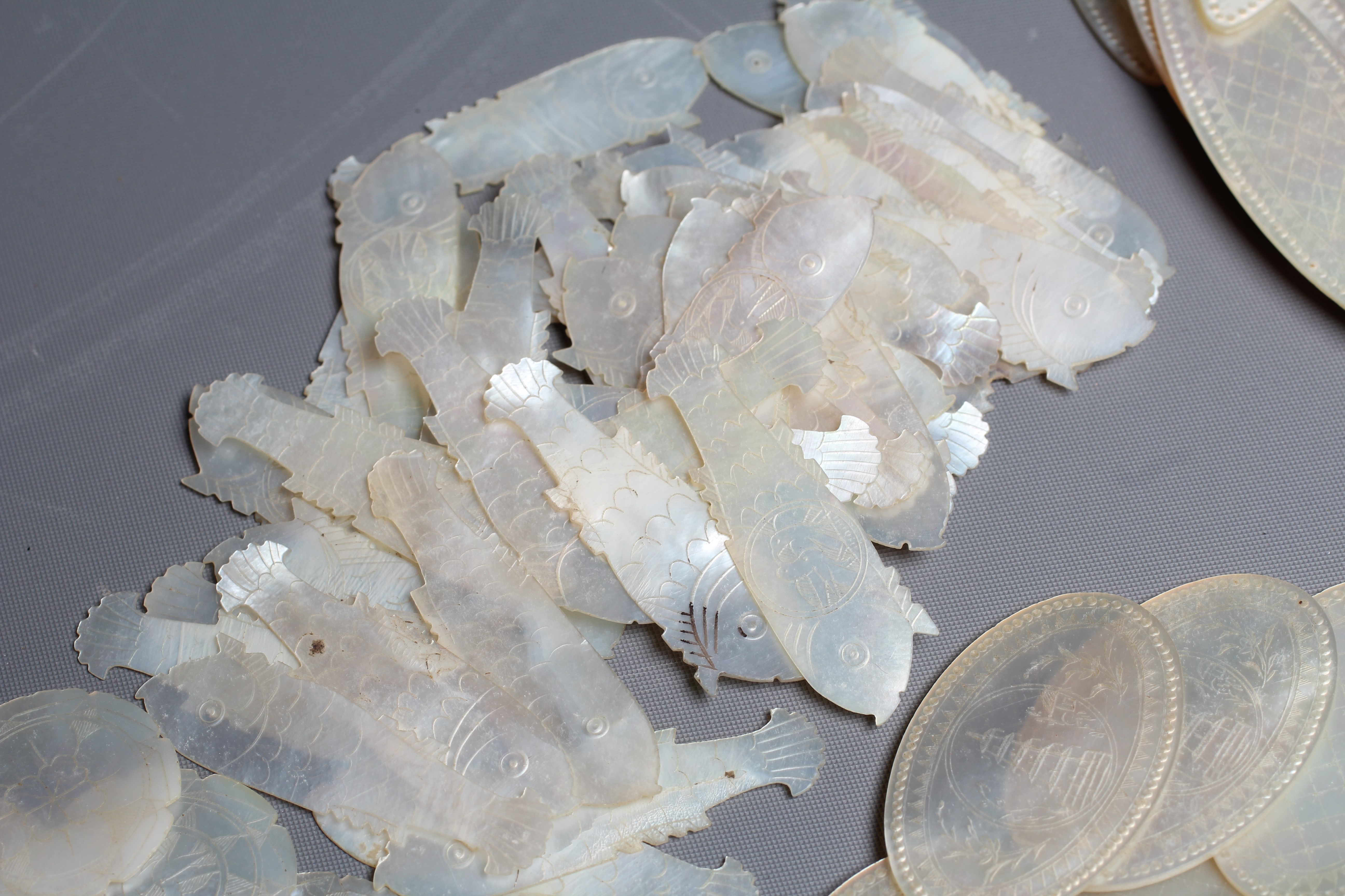 A COLLECTION OF CHINESE MOTHER-OF-PEARL GAMING COUNTERS Image