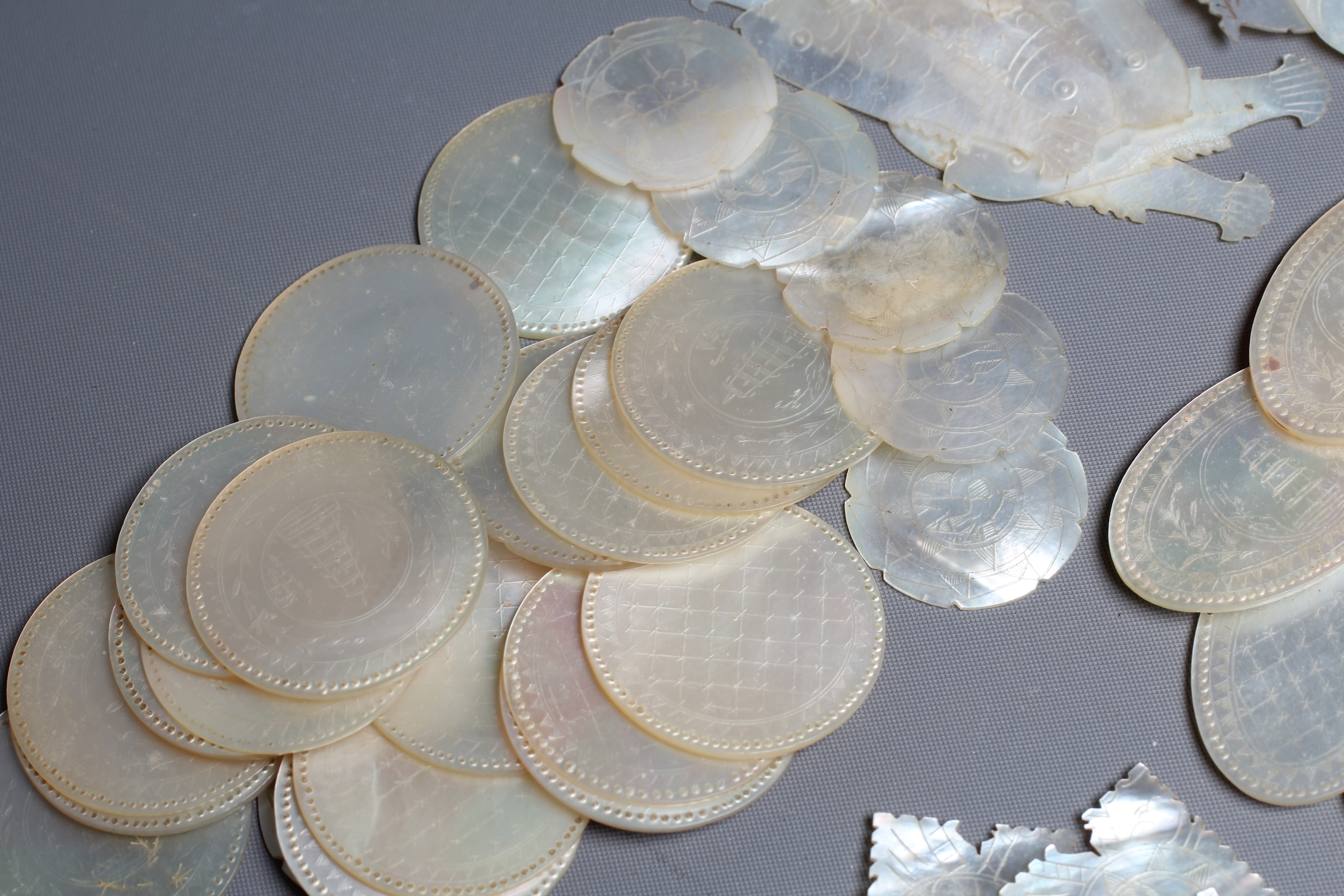 A COLLECTION OF CHINESE MOTHER-OF-PEARL GAMING COUNTERS Image
