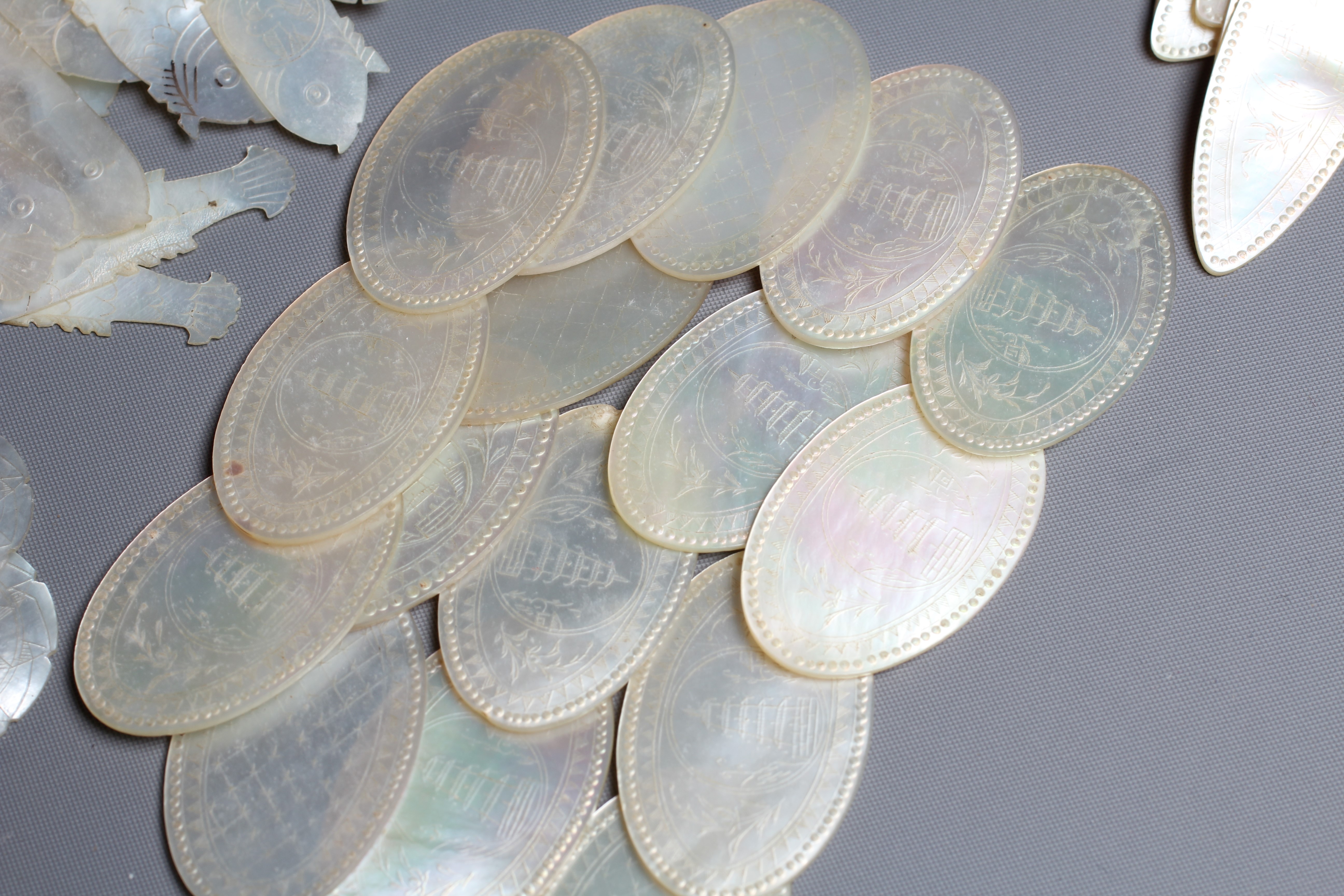 A COLLECTION OF CHINESE MOTHER-OF-PEARL GAMING COUNTERS Image
