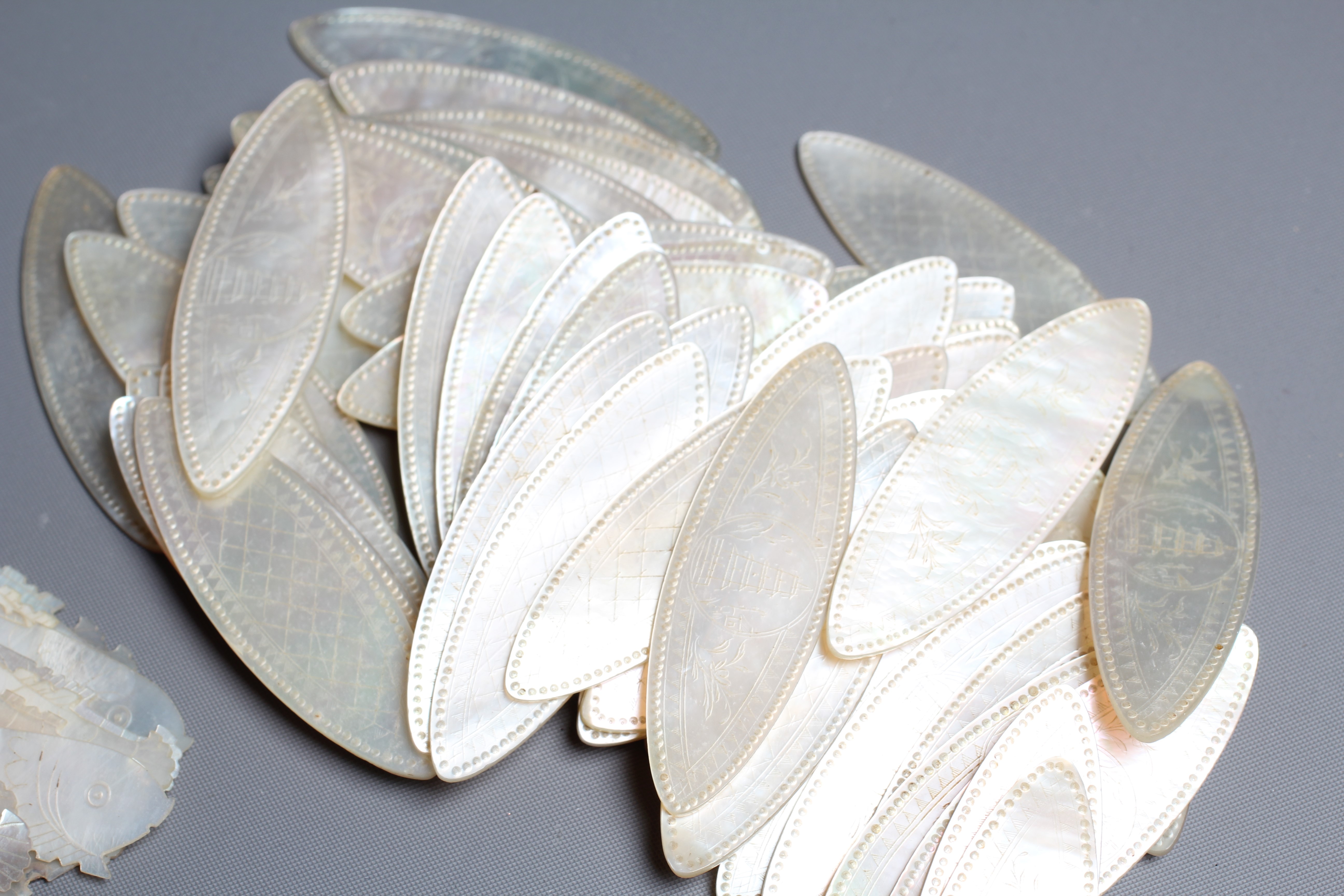 A COLLECTION OF CHINESE MOTHER-OF-PEARL GAMING COUNTERS Image