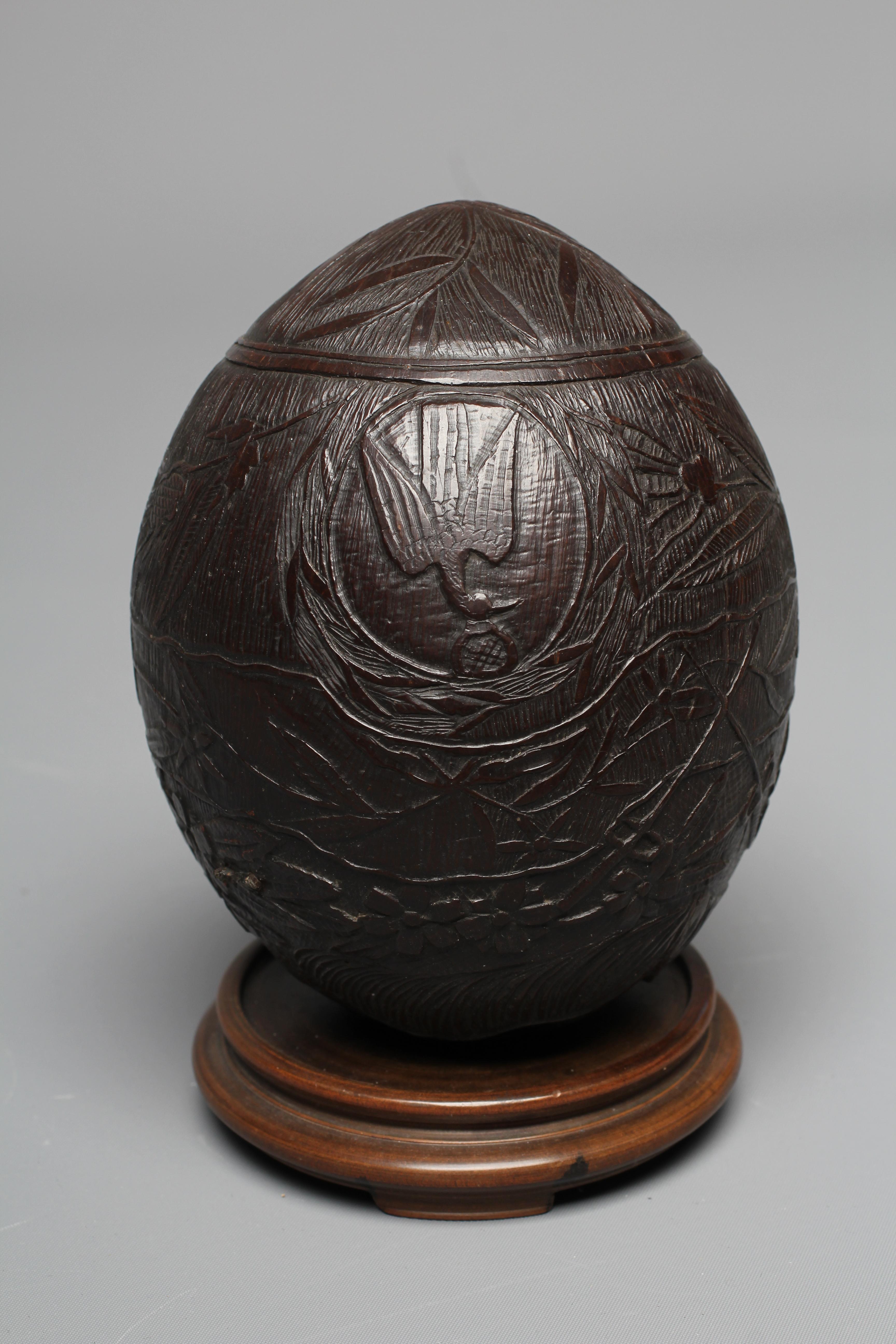 A NAPOLEONIC BUGBEAR COCONUT FLASK, early 19th century, incise carved with crossed swords, Imperial Image