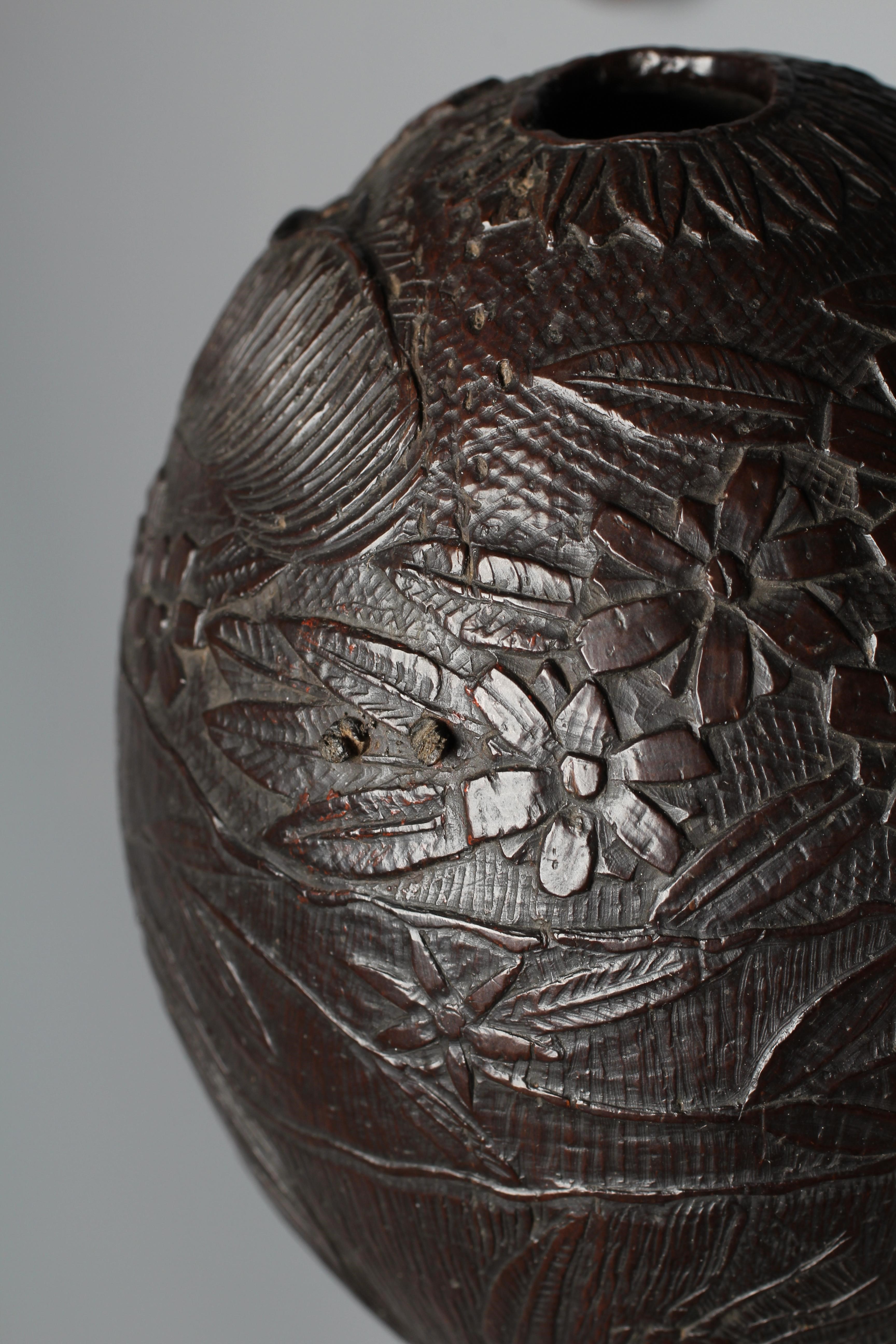A NAPOLEONIC BUGBEAR COCONUT FLASK, early 19th century, incise carved with crossed swords, Imperial Image