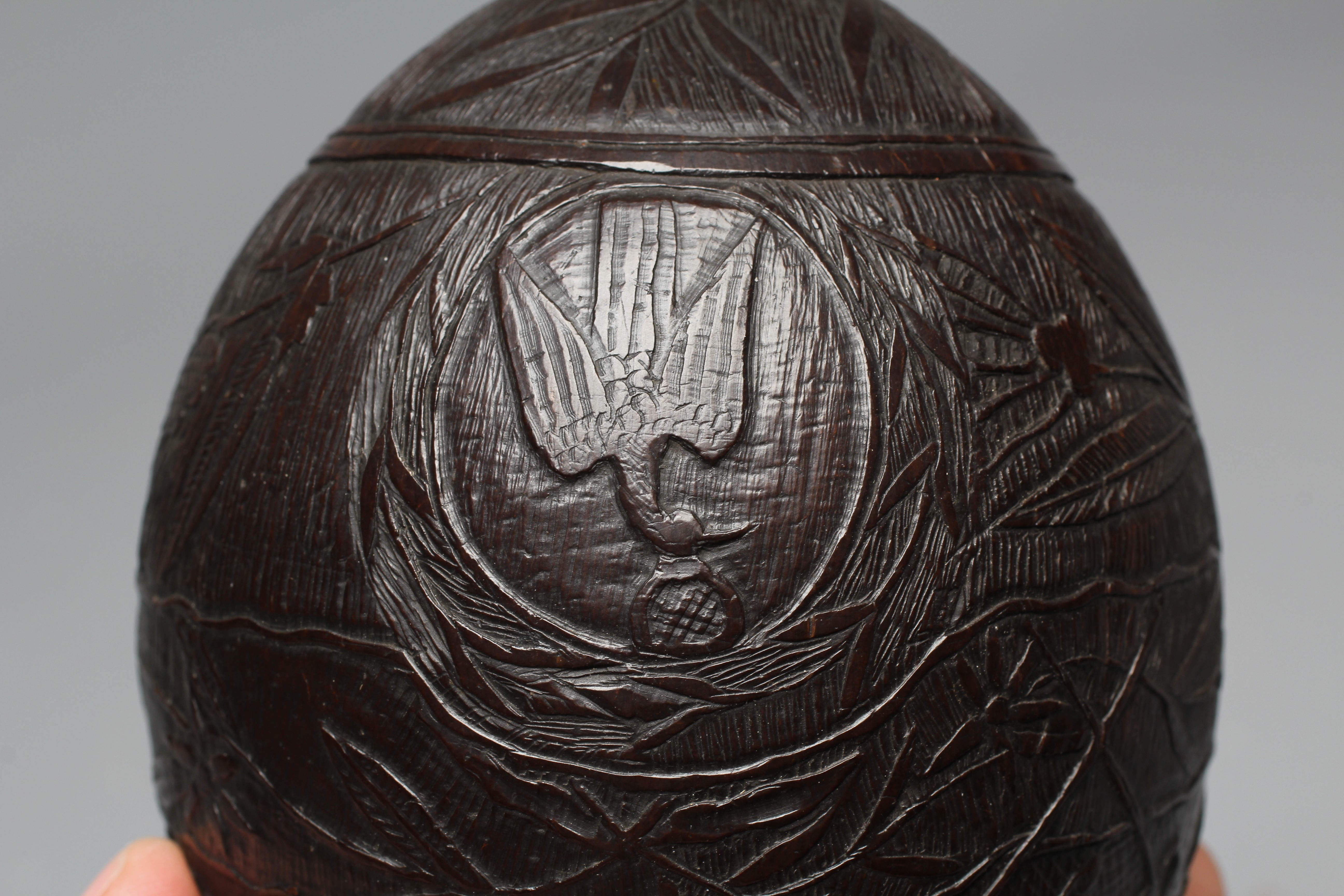 A NAPOLEONIC BUGBEAR COCONUT FLASK, early 19th century, incise carved with crossed swords, Imperial Image