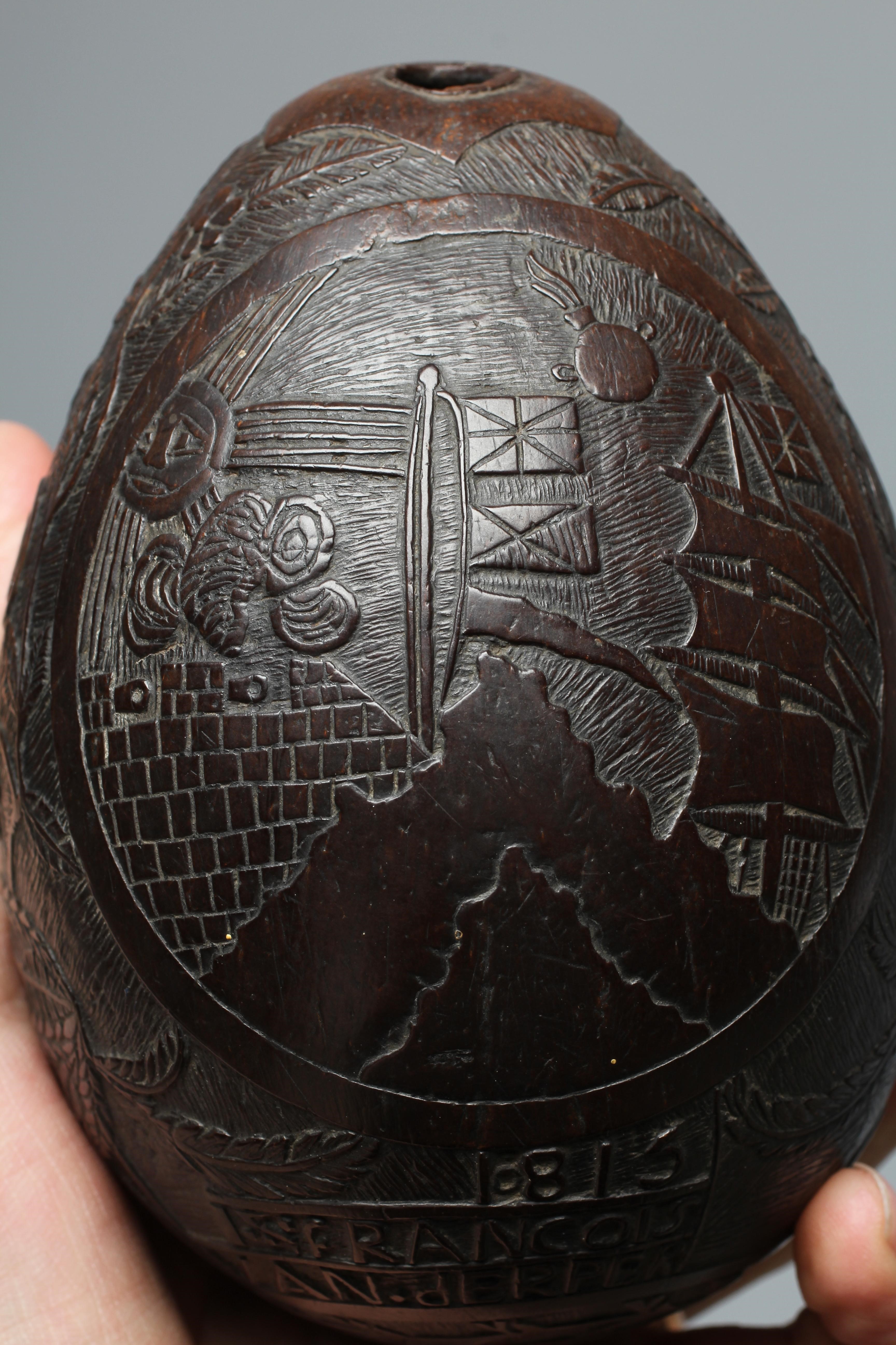 A NAPOLEONIC BUGBEAR COCONUT FLASK Image