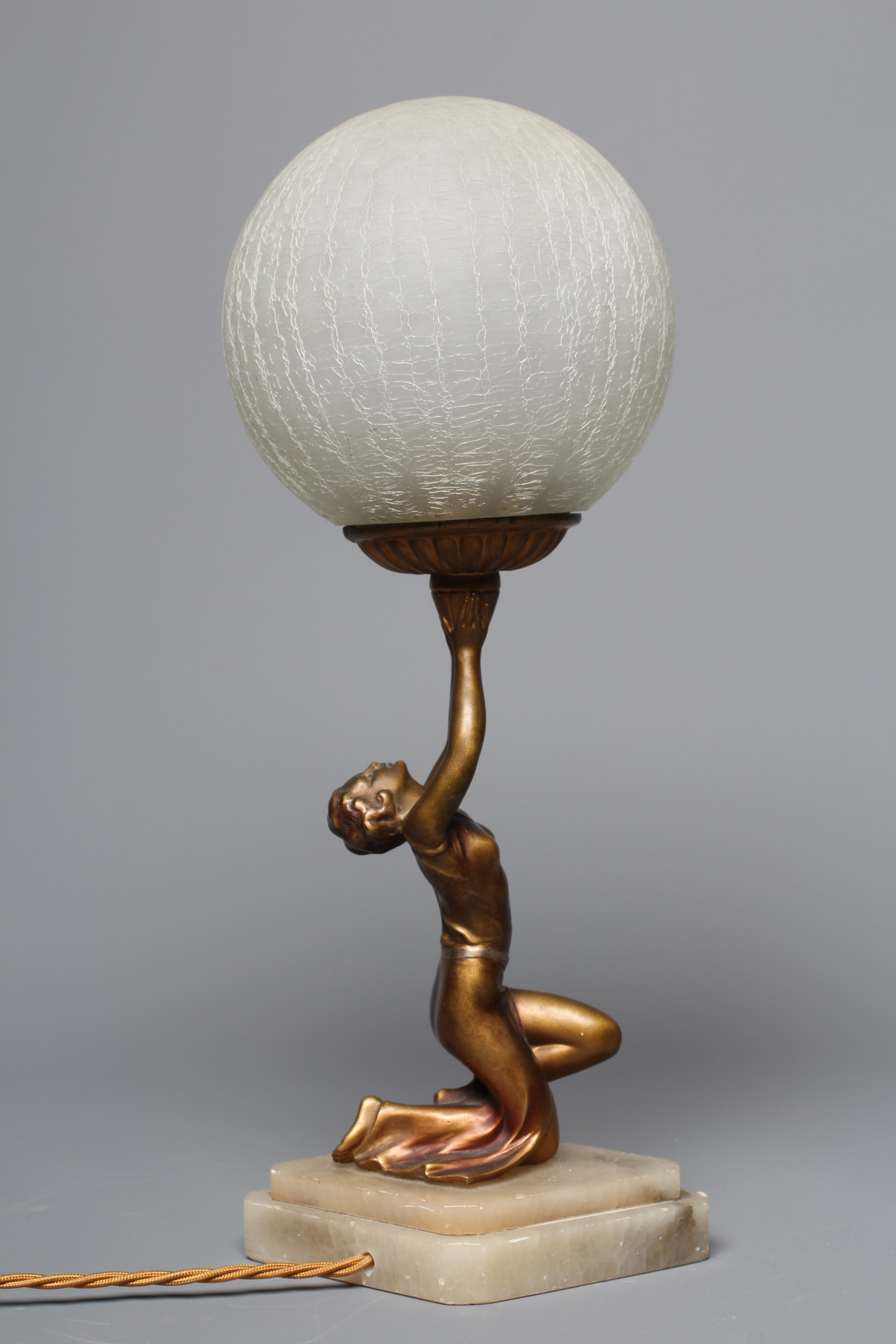 AN ART DECO GILDED SPELTER FIGURAL LAMP Image