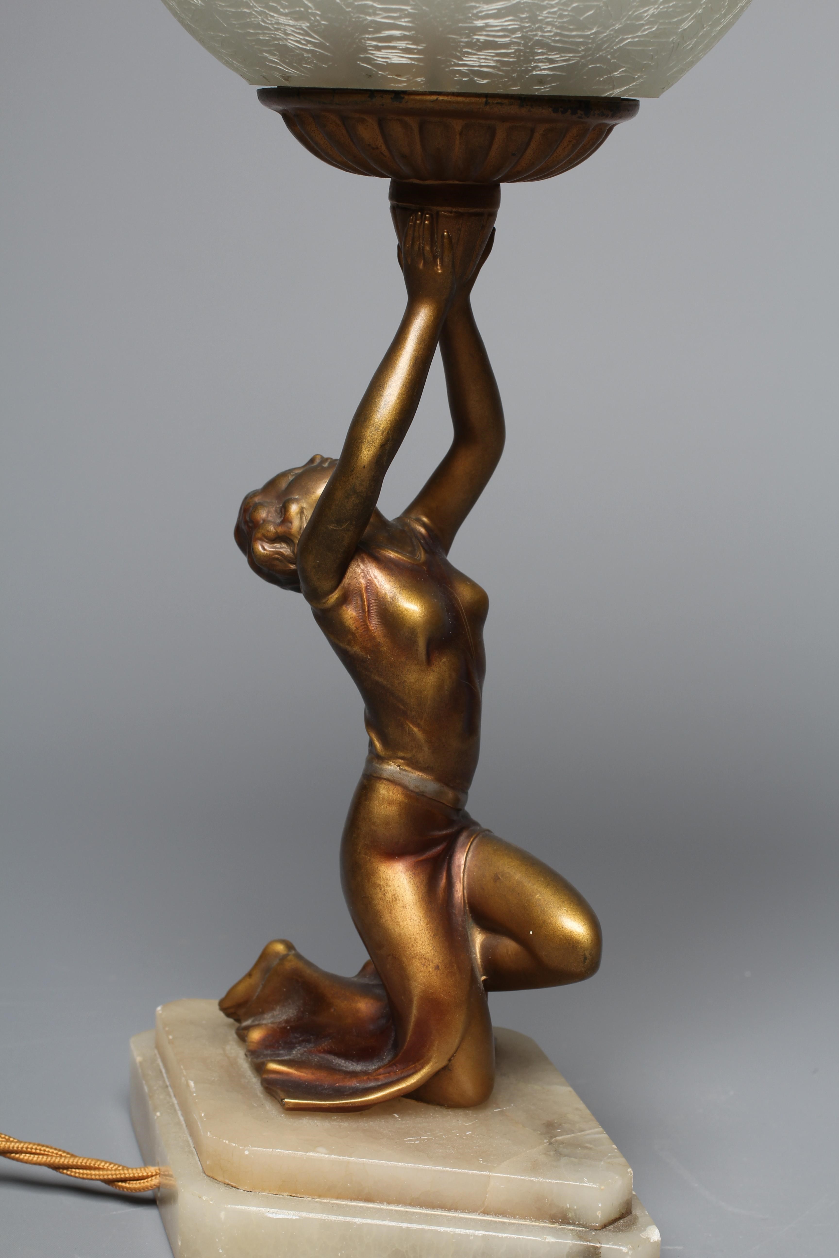 AN ART DECO GILDED SPELTER FIGURAL LAMP Image