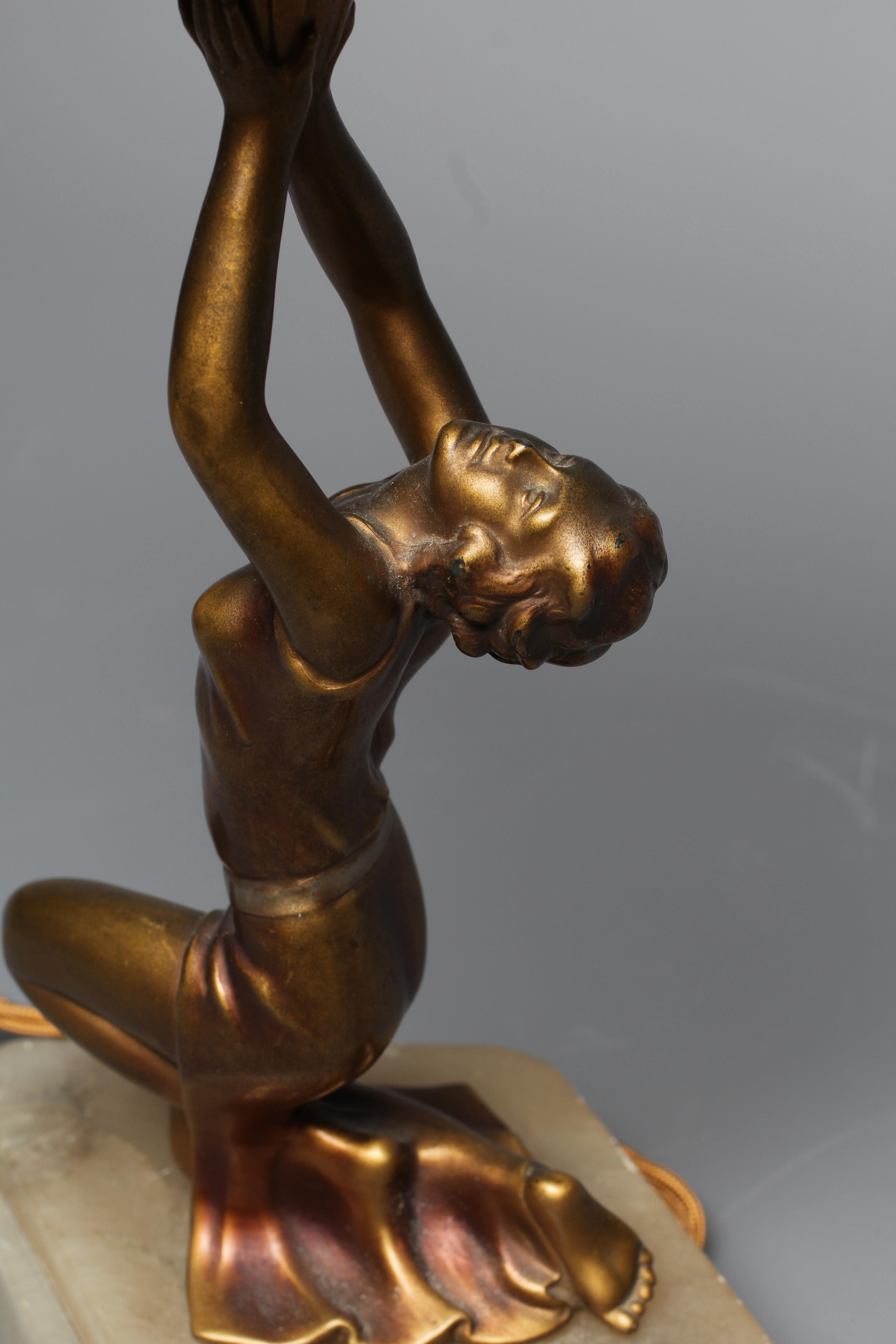 AN ART DECO GILDED SPELTER FIGURAL LAMP Image