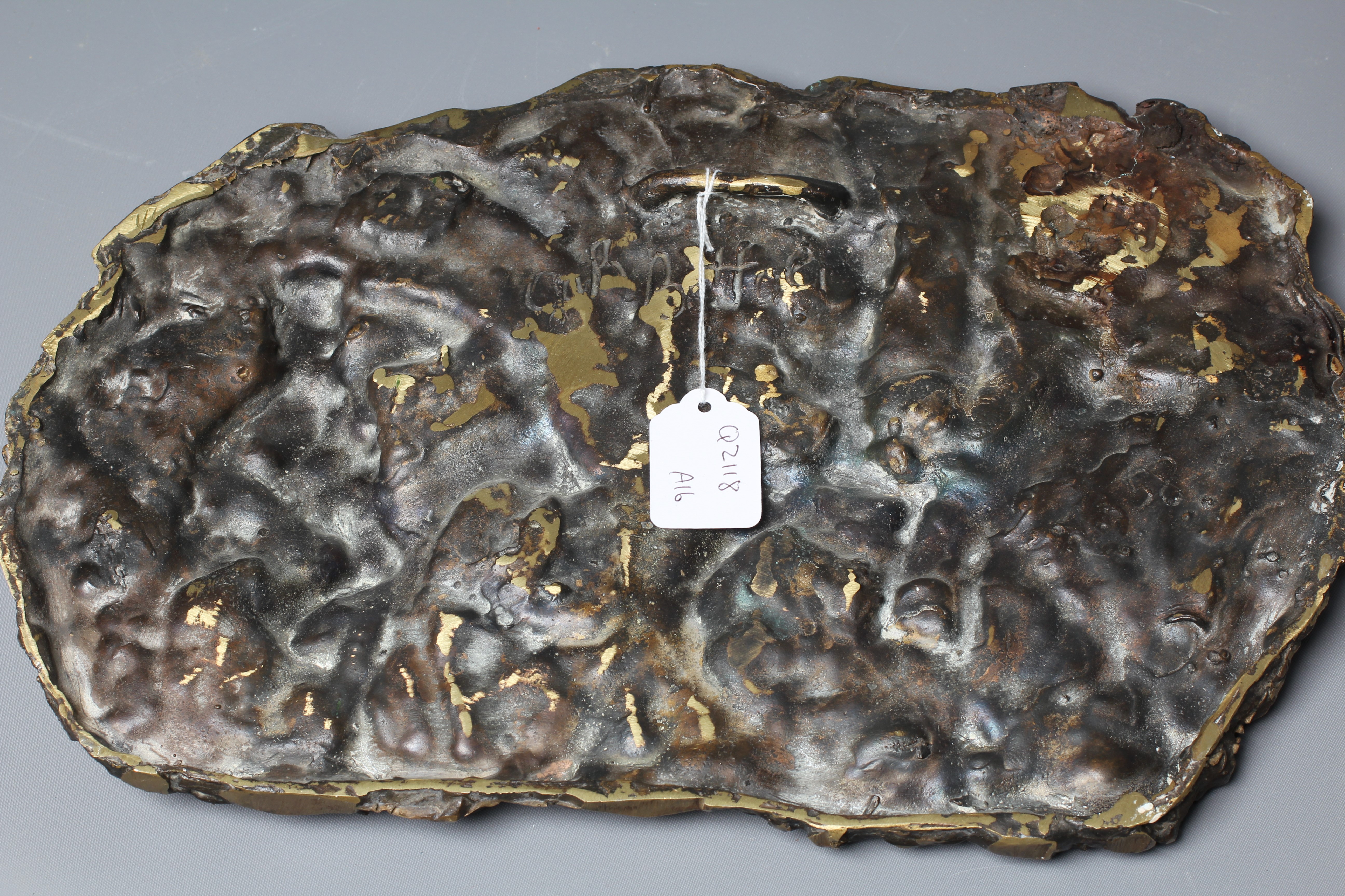 A 20TH CENTURY CONTINENTAL BRONZE PLAQUE OF DON QUIXOTE, indistinctly signed verso, with a dark Image