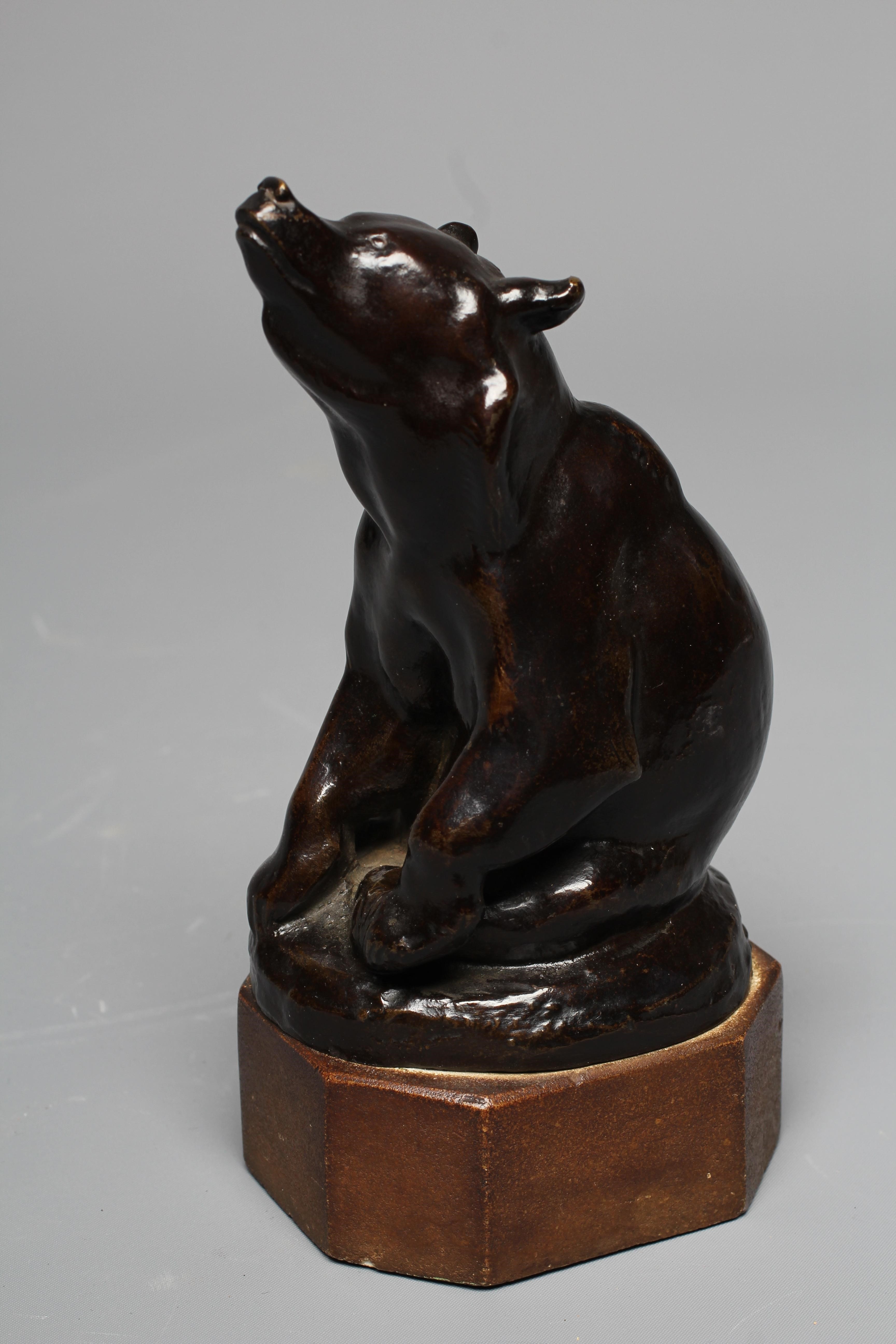 OTTO WEISMULLER (1892-1974) Seated Bear, bronze with dark brown patina, signed, on a stone plinth, Image