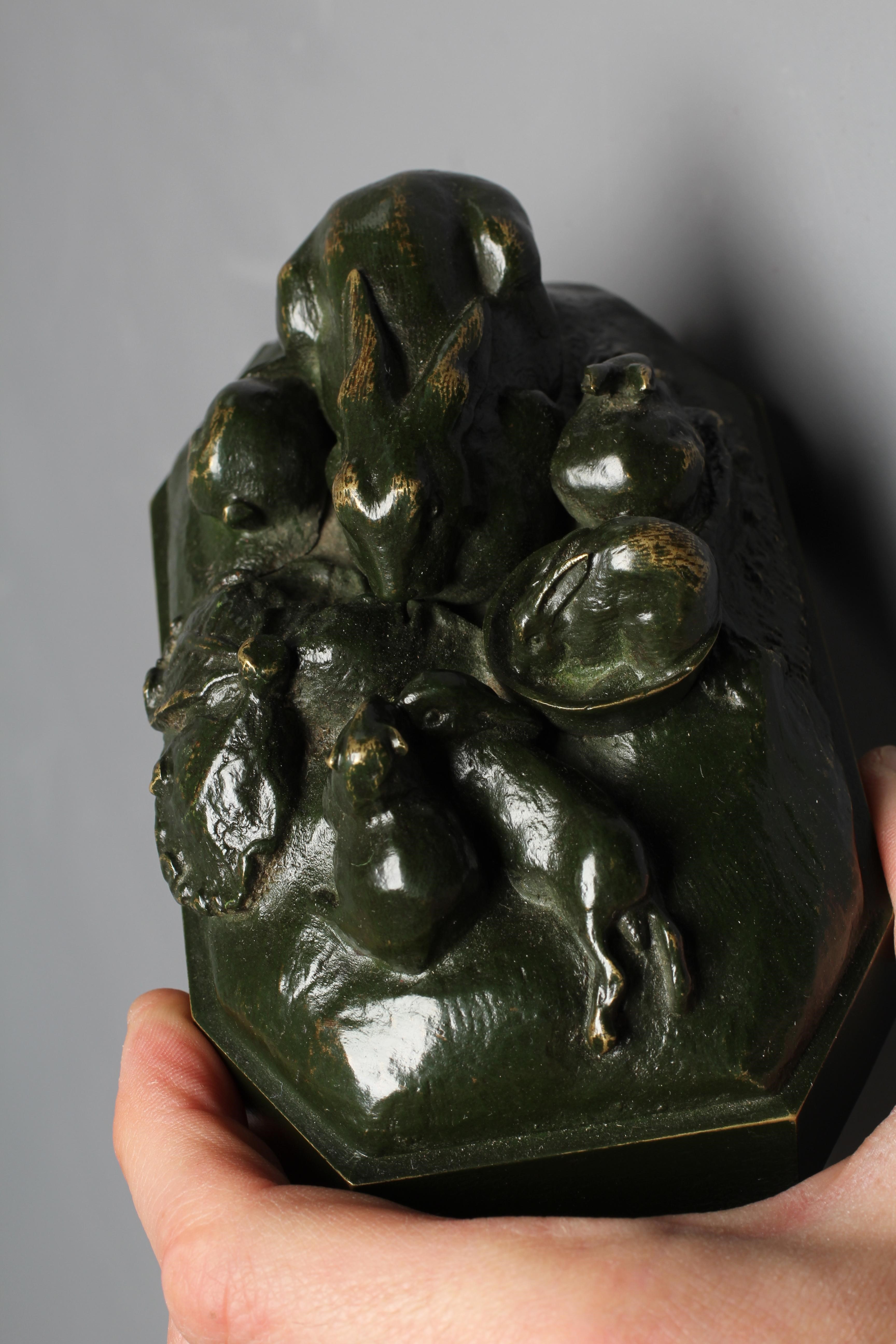 A 20TH CENTURY BRONZE OF A RABBIT FAMILY with dark green patina, 3" high Image