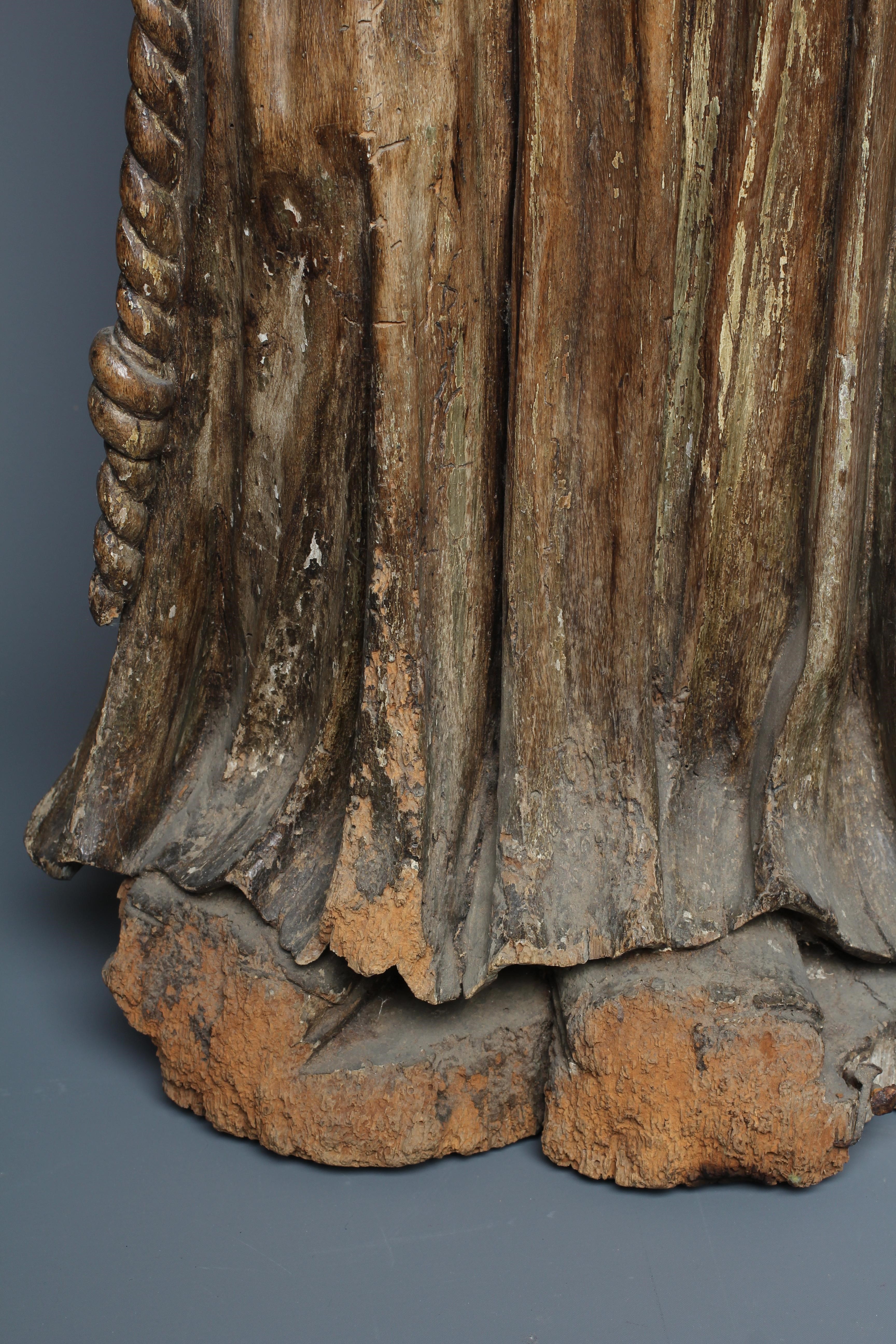 A CONTINENTAL CARVED OAK FIGURE OF A SAINT Image