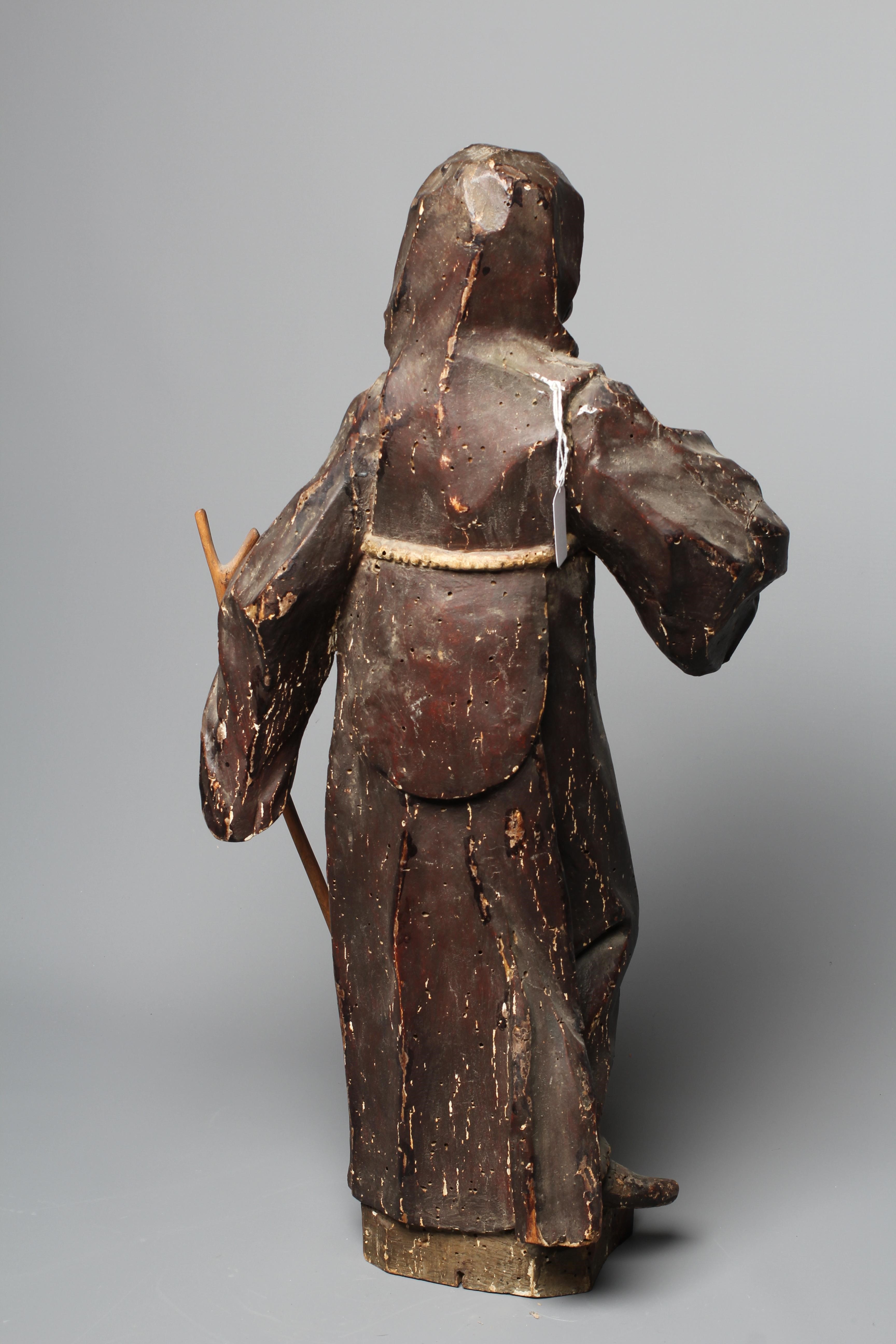 A CONTINENTAL SCHOOL PAINTED WOOD CARVED FIGURE OF A SAINT, possibly 18th century, full length Image