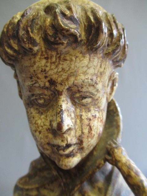 A CARVED WOOD AND PAINTED FIGURE OF ST ANTHONY OF PADUA, 17th century, modelled standing and with a Image