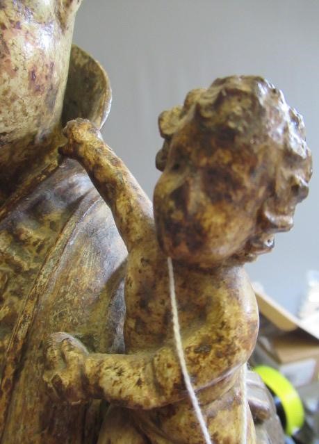 A CARVED WOOD AND PAINTED FIGURE OF ST ANTHONY OF PADUA, 17th century, modelled standing and with a Image