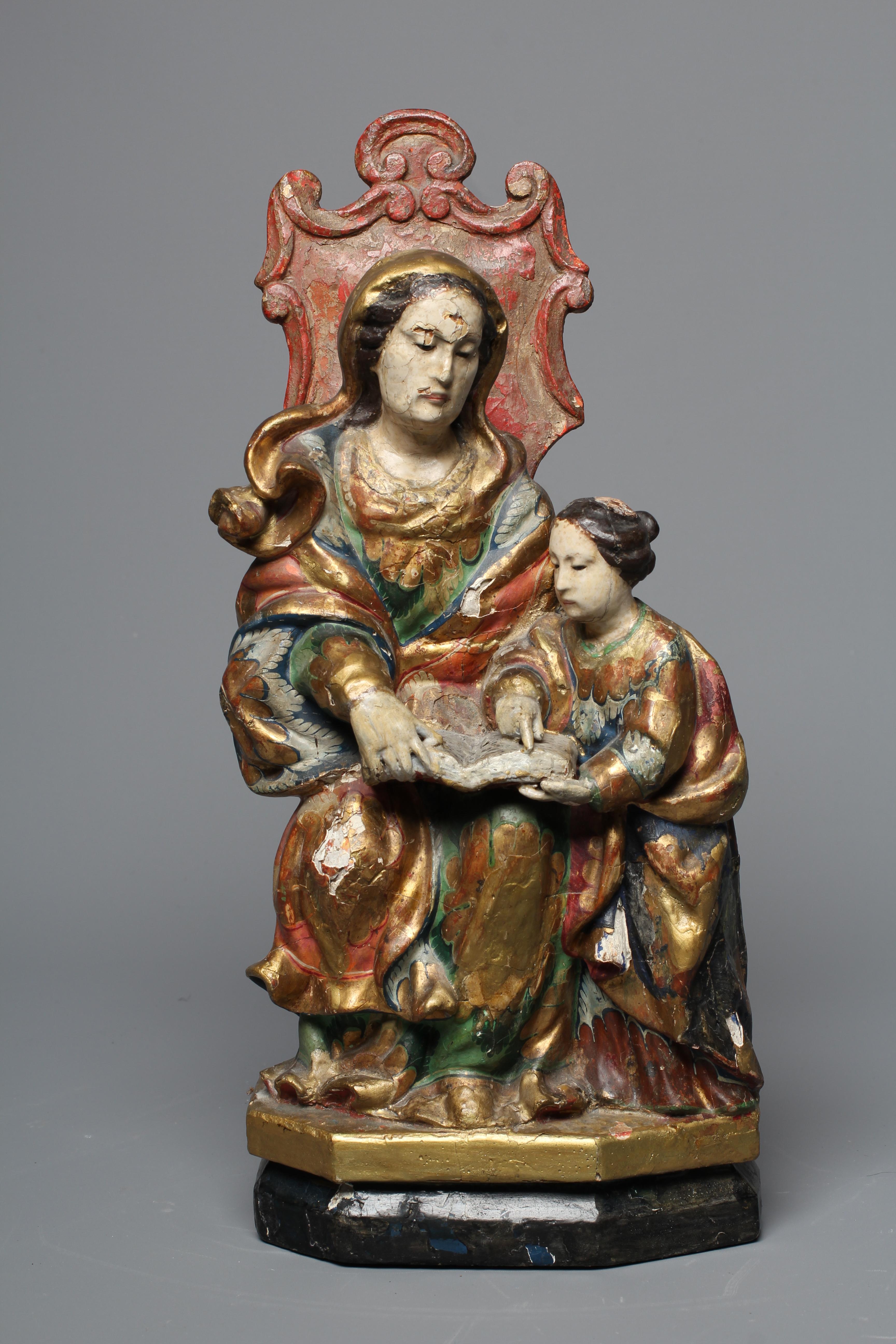 AN 18TH CENTURY CARVED WOOD AND POLYCHROME DECORATED FIGURE OF ST ANN AND THE VIRGIN Image