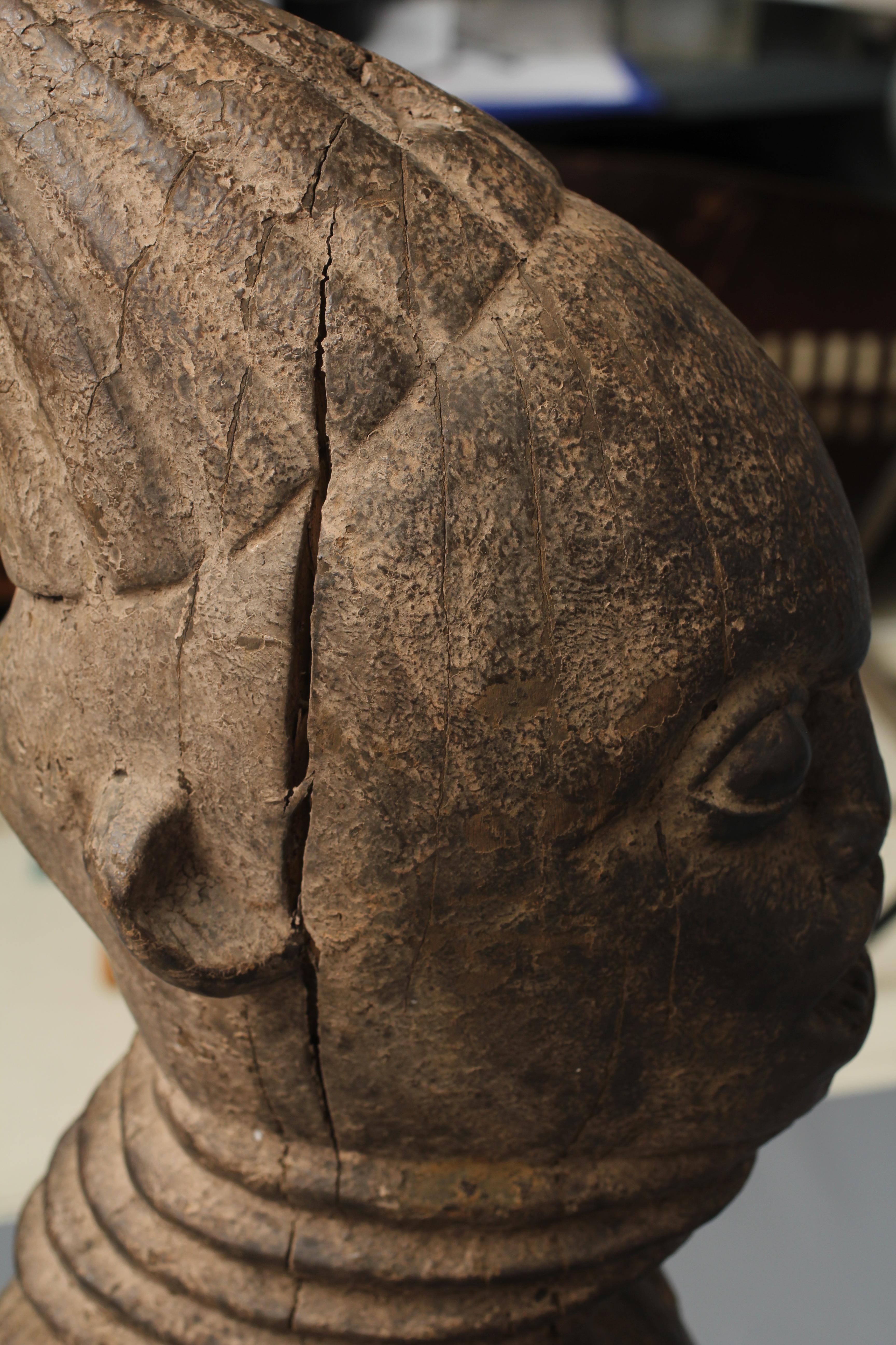 A BAULE FERTILITY FIGURE, Ivory Coast, carved with braided coiffure, neck rings, arms free to the Image