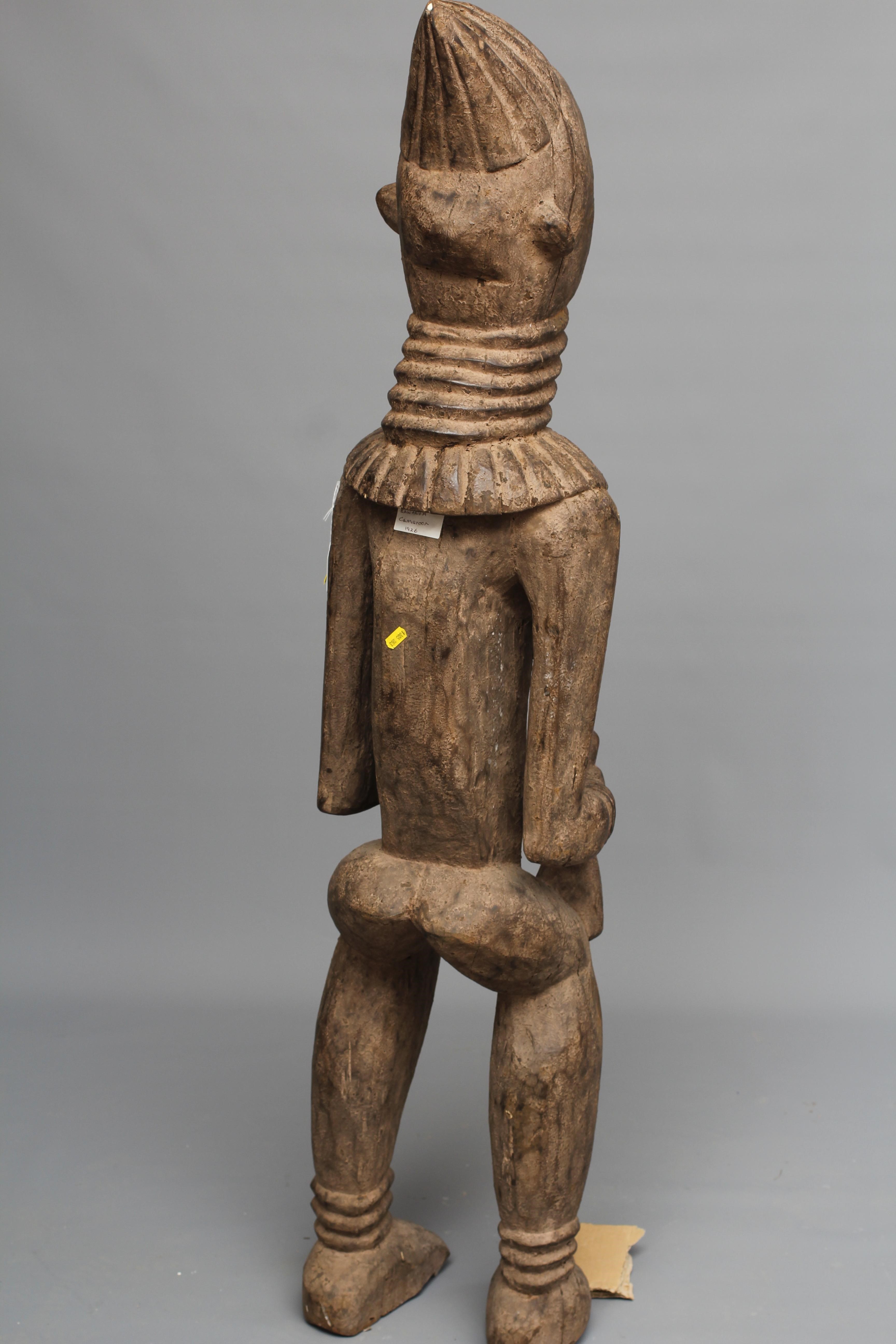 A BAULE FERTILITY FIGURE, Ivory Coast, carved with braided coiffure, neck rings, arms free to the Image