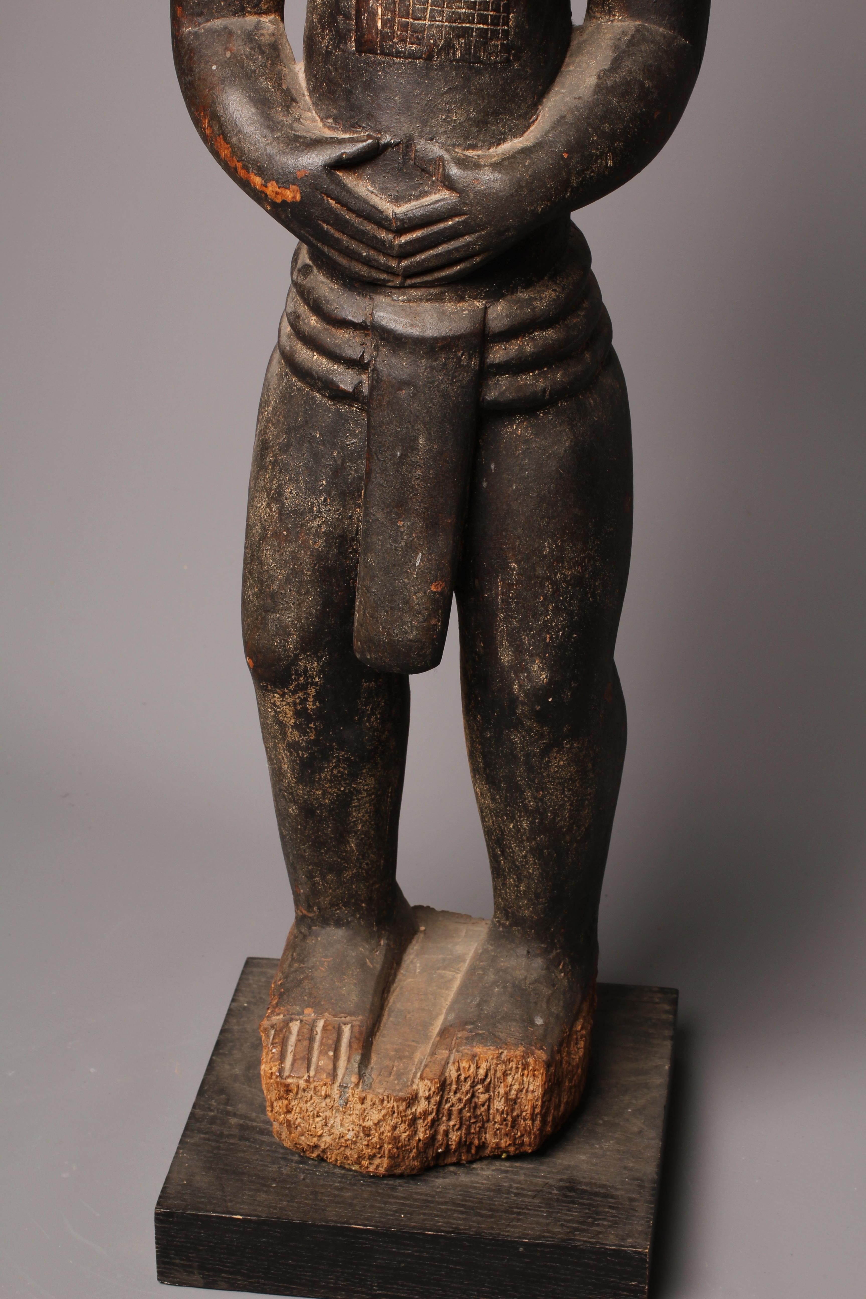A BAULE FERTILITY FIGURE, Ivory Coast, carved with keloid scars to the head, chest and abdomen, Image