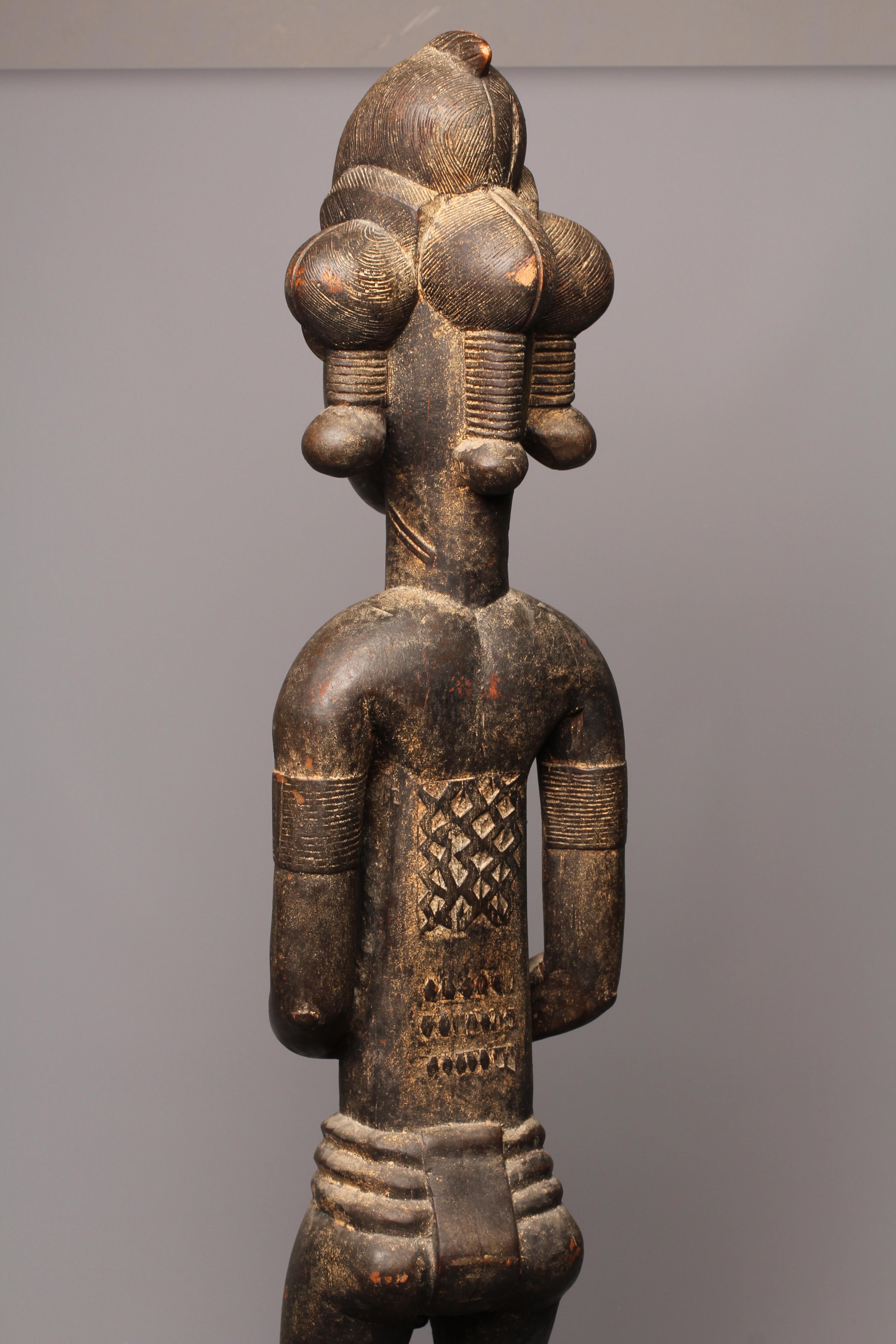 A BAULE FERTILITY FIGURE, Ivory Coast, carved with keloid scars to the head, chest and abdomen, Image